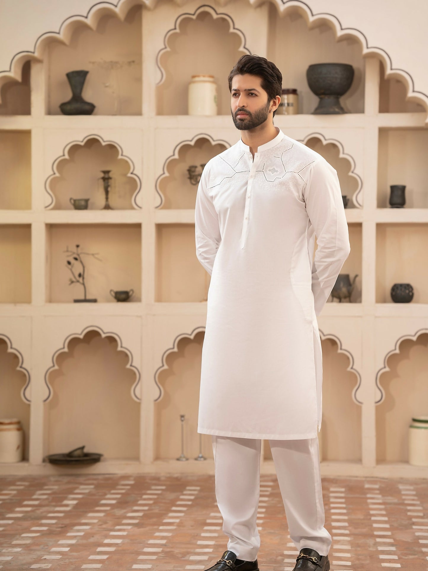 Men's unstitched off-white kameez shalwar from the Miraas Collection by Fabrich, made with luxury soft fine 100% cotton, featuring cotton-thread cutwork chest embroidery with signature pattern and design, finished with designer buttons and branded details.