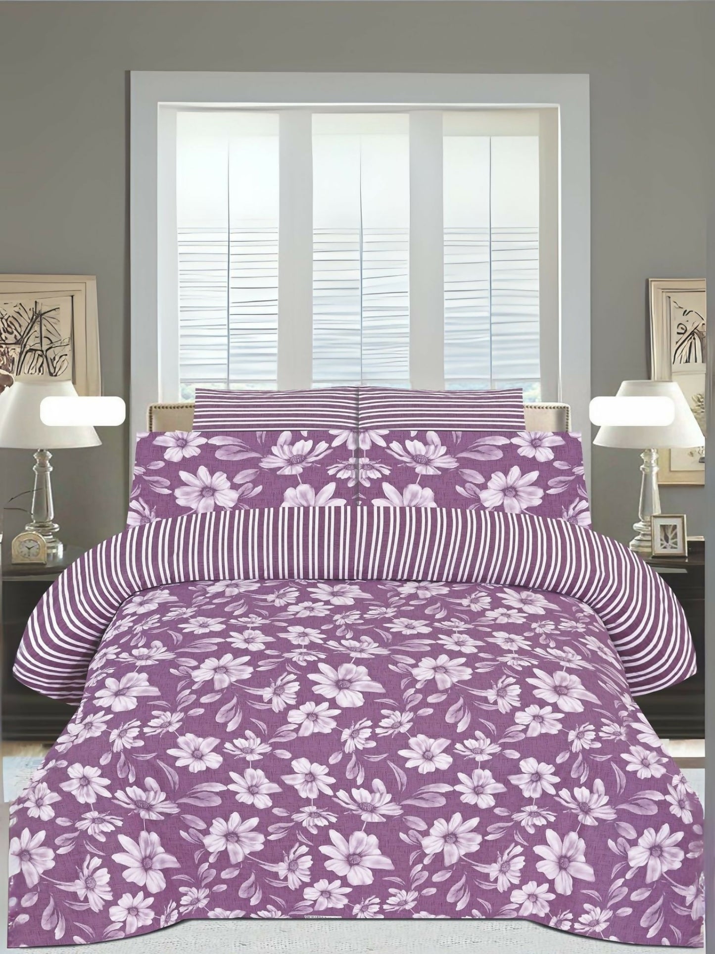 A pink king size bedsheet with white floral design, neatly spread on a bed with matching pillow covers.