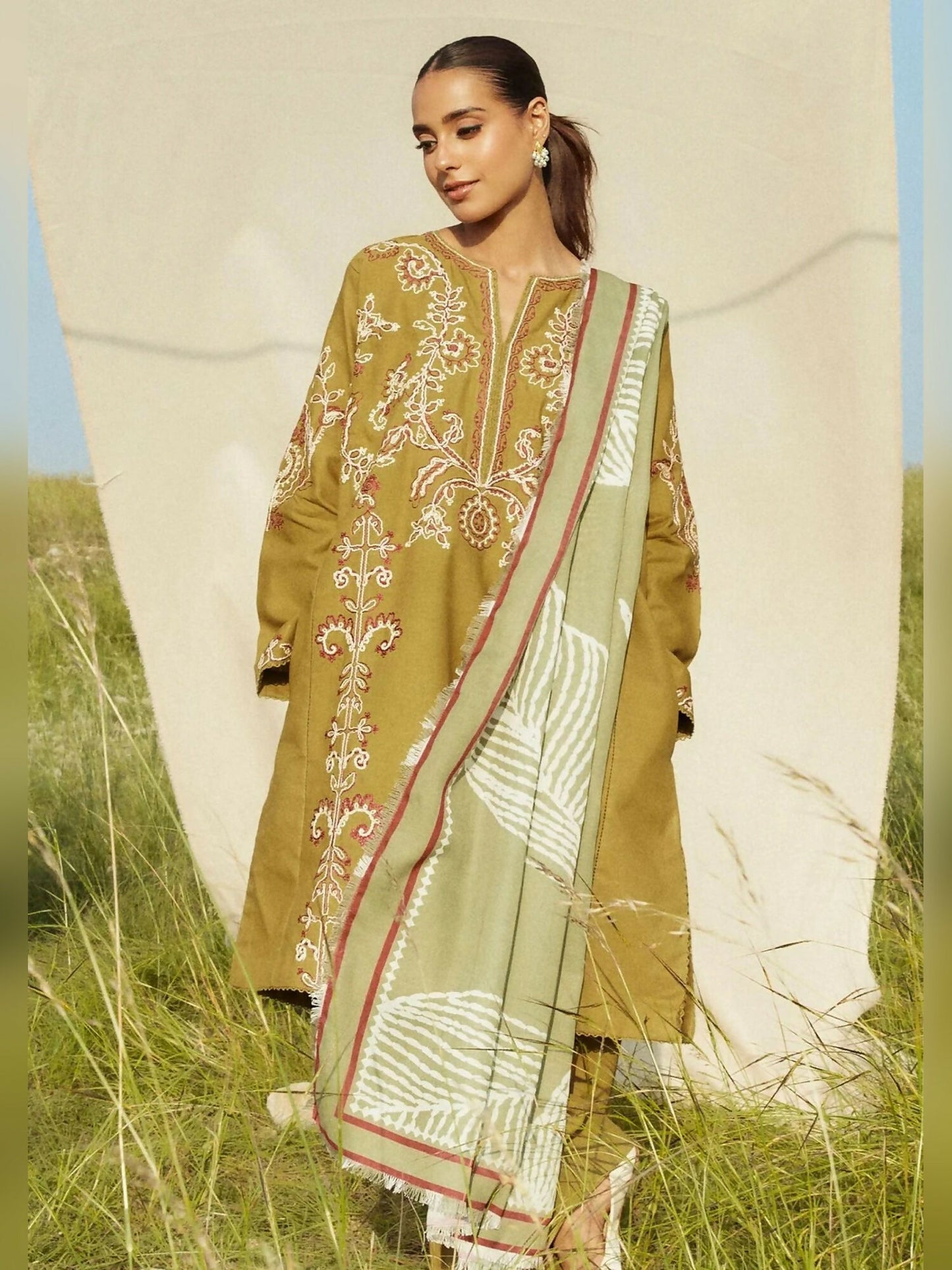 Olive green embroidered khaddar unstitched 3-piece suit with printed shawl by Zara Shahjahan.
