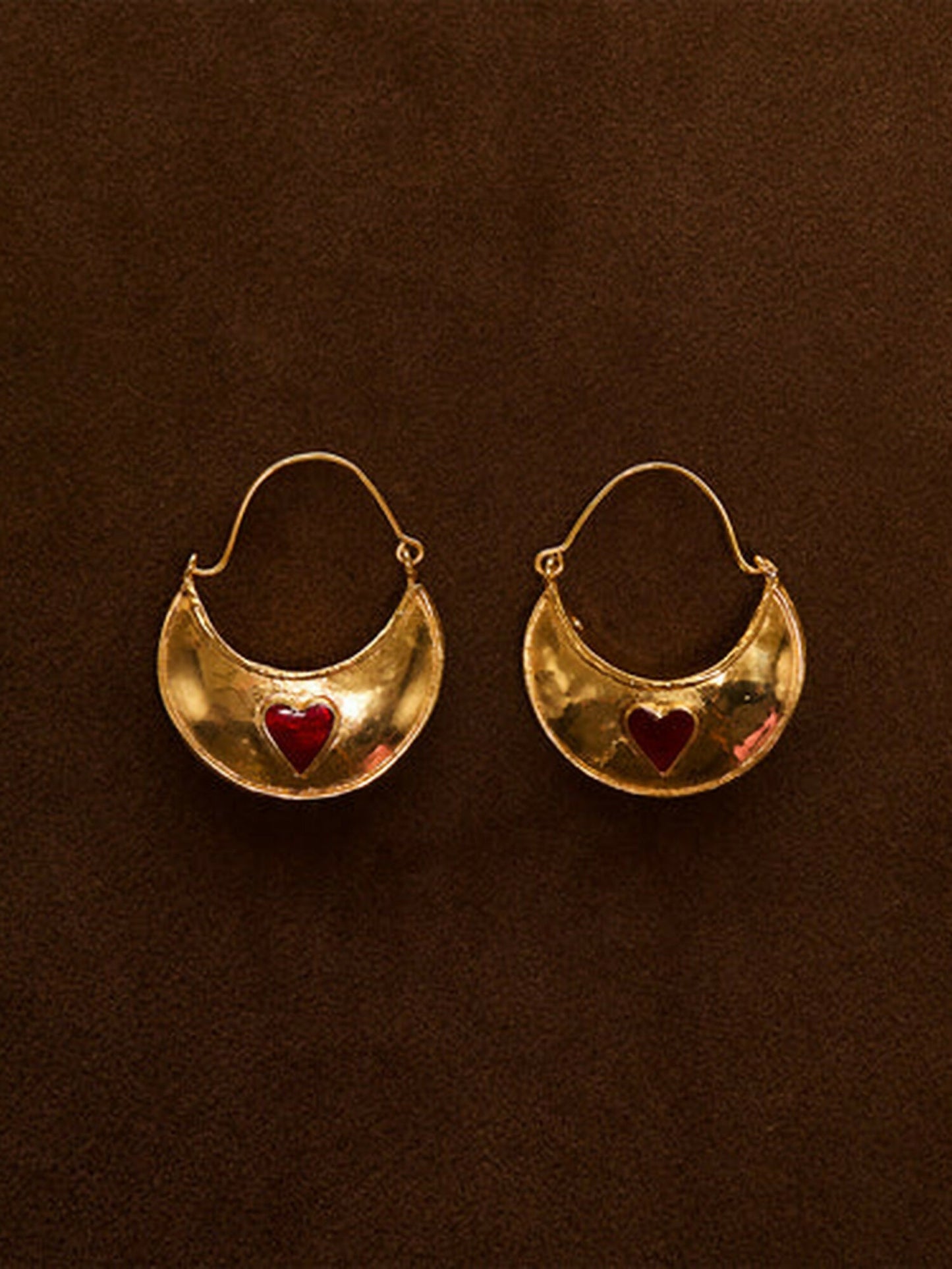 Jugnu by Hussain Rehar Heart Crescent gold earrings with crescent-shaped design, glossy polished finish, and embedded red heart detail, modern romantic accessory.
