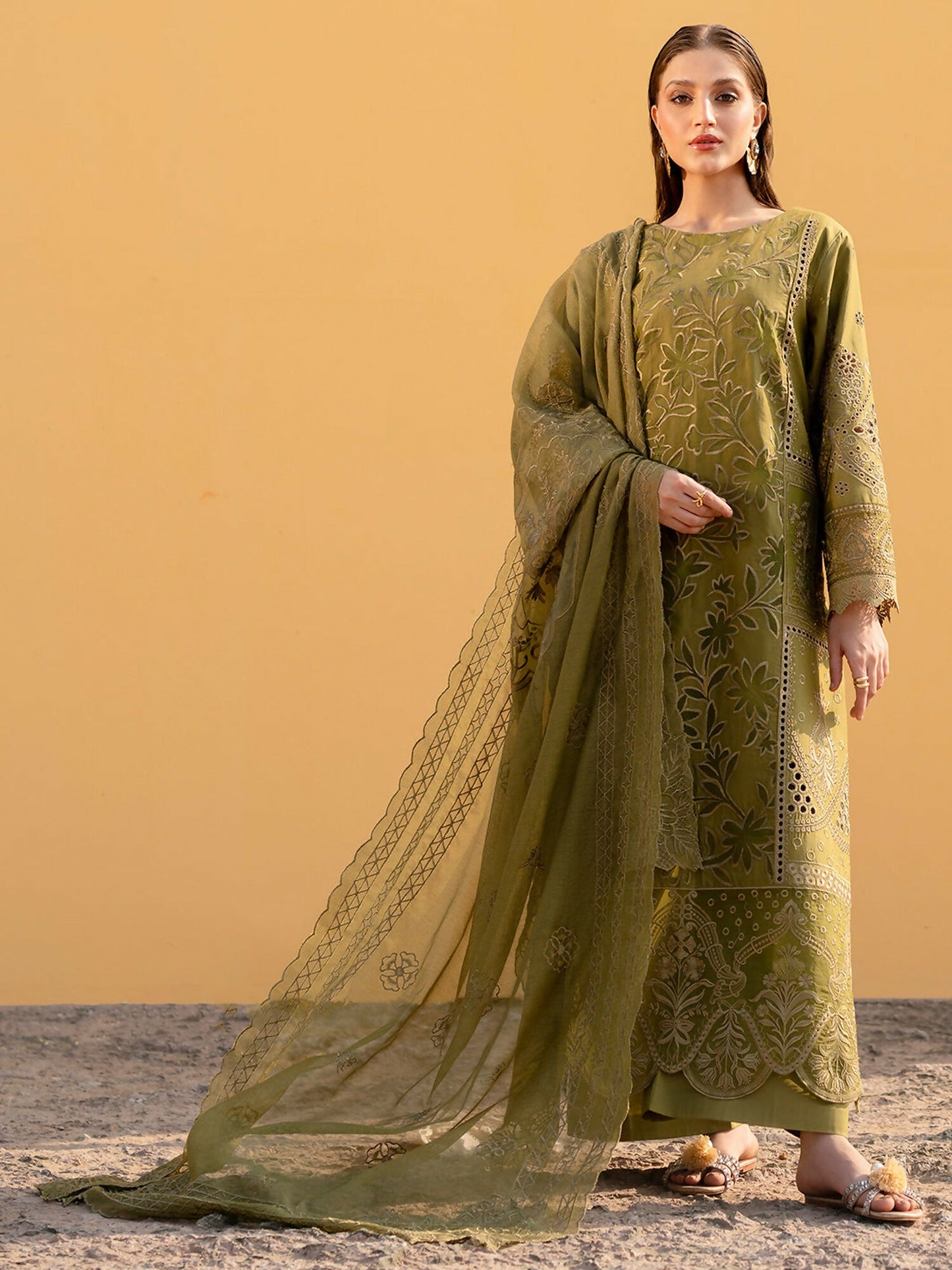 Unstitched 3-piece lawn suit from Mahnur Sirene collection with embroidered shirt, cotton net dupatta, dyed trouser, and lining fabric.