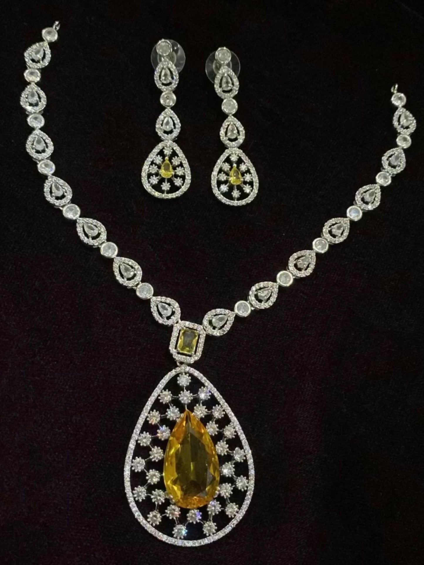 Noor Bilal one carat zircon necklace set with shimmering stones and matching earrings