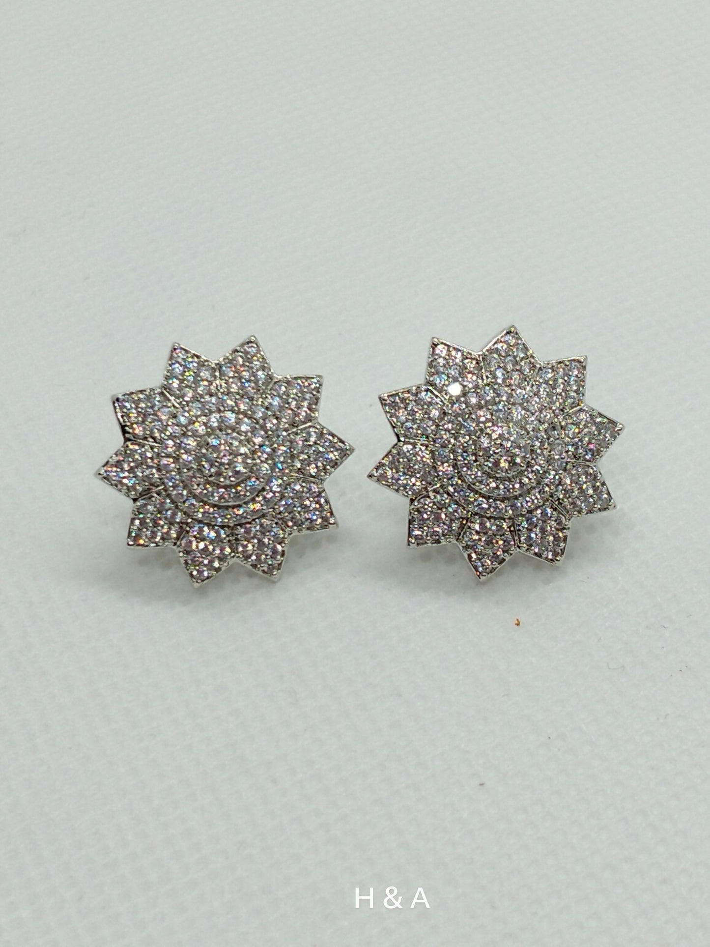 H&A Jewellery one carat floral zirconia stud earrings.