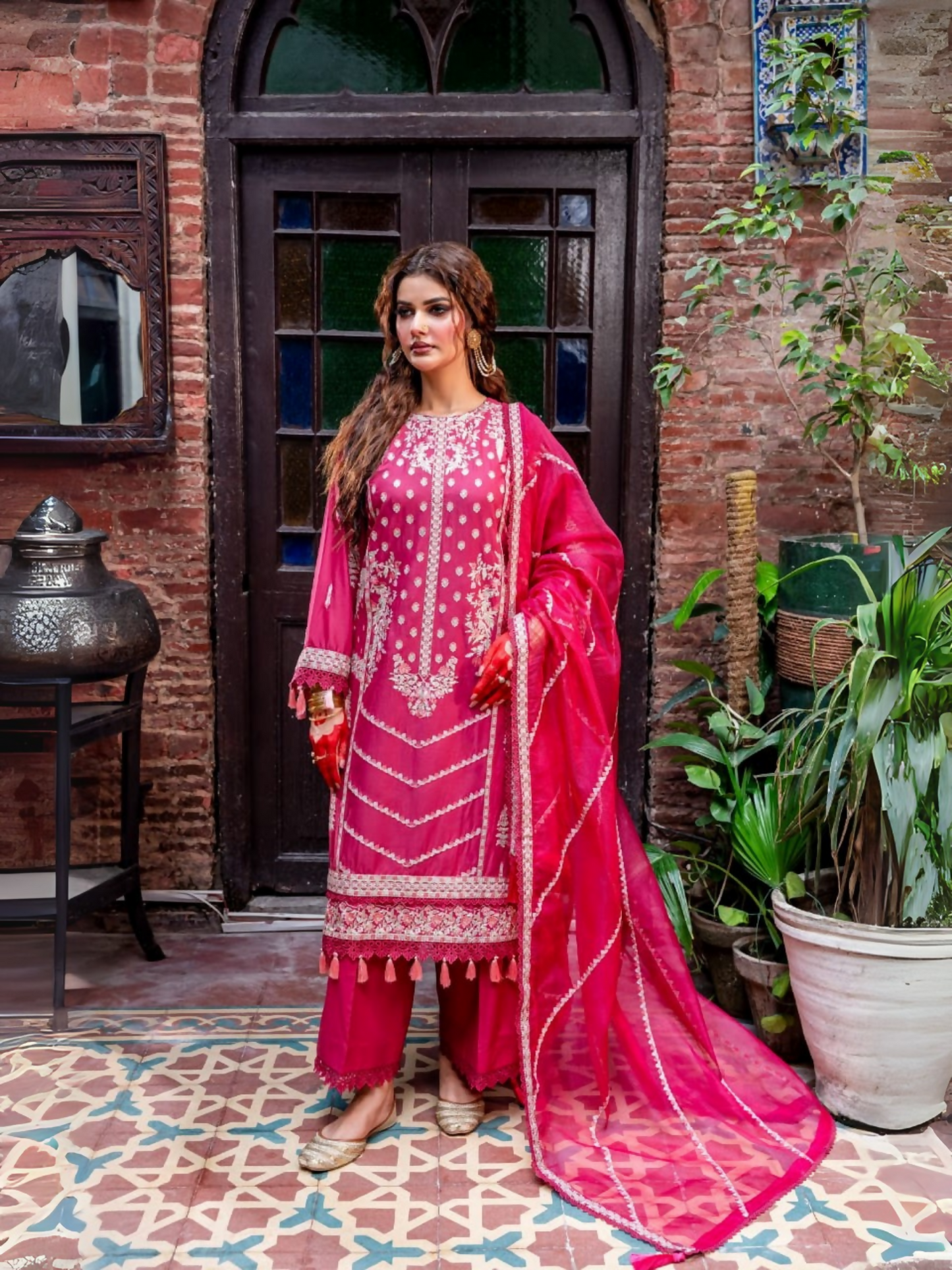 Fatima Hussain unstitched 3-piece suit with embroidered 6-panel lawn shirt, embroidered cotton net dupatta, and dyed cotton trouser.