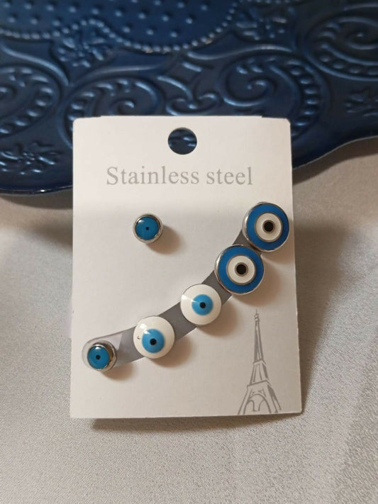 Joyels stainless steel evil eye studs featuring bold blue and white design, symbolizing style and protection.