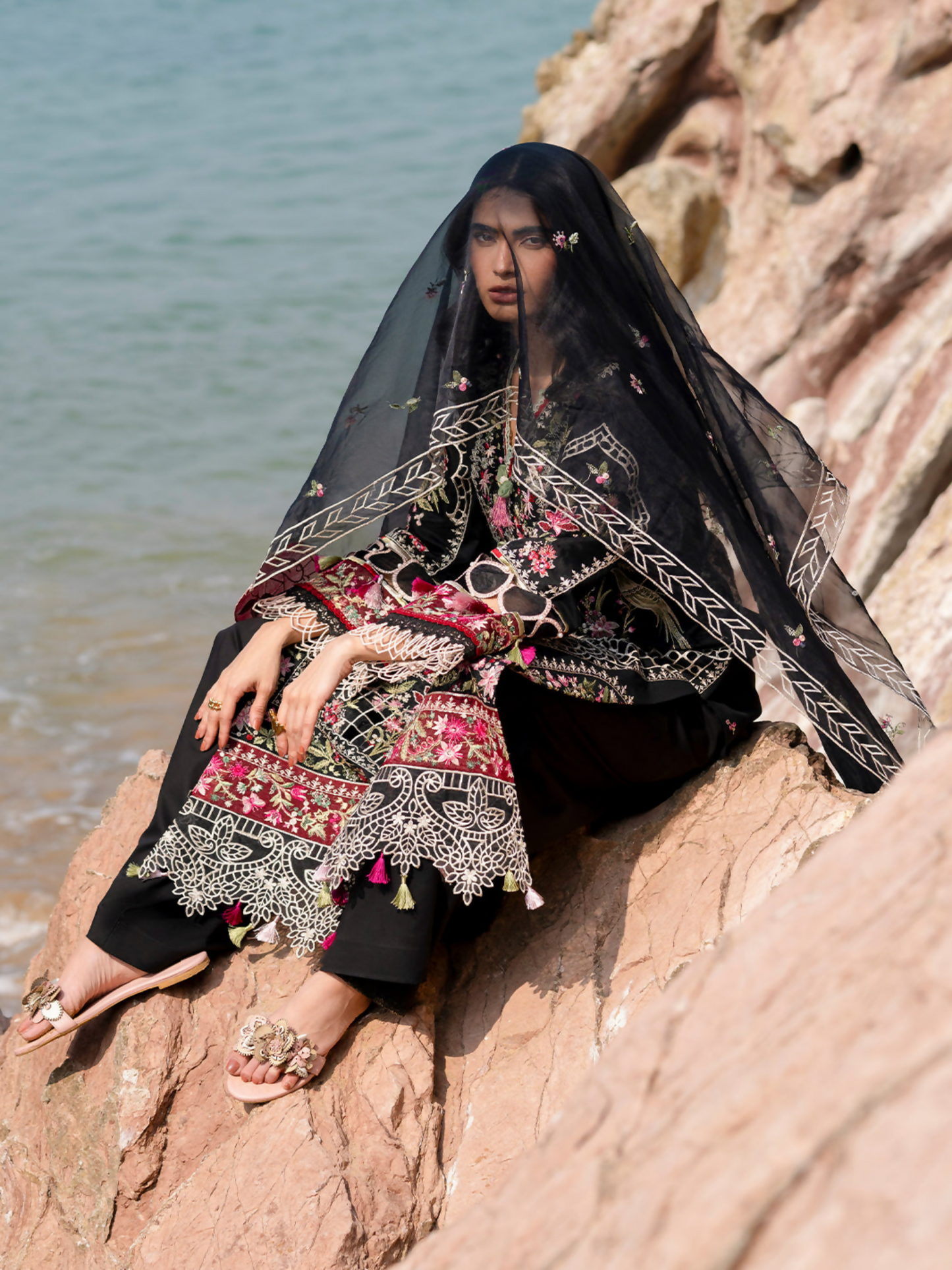 Unstitched 3-piece embroidered suit with embroidered lawn front, dyed back and sleeves, organza dupatta, dyed trouser, and lining fabric.