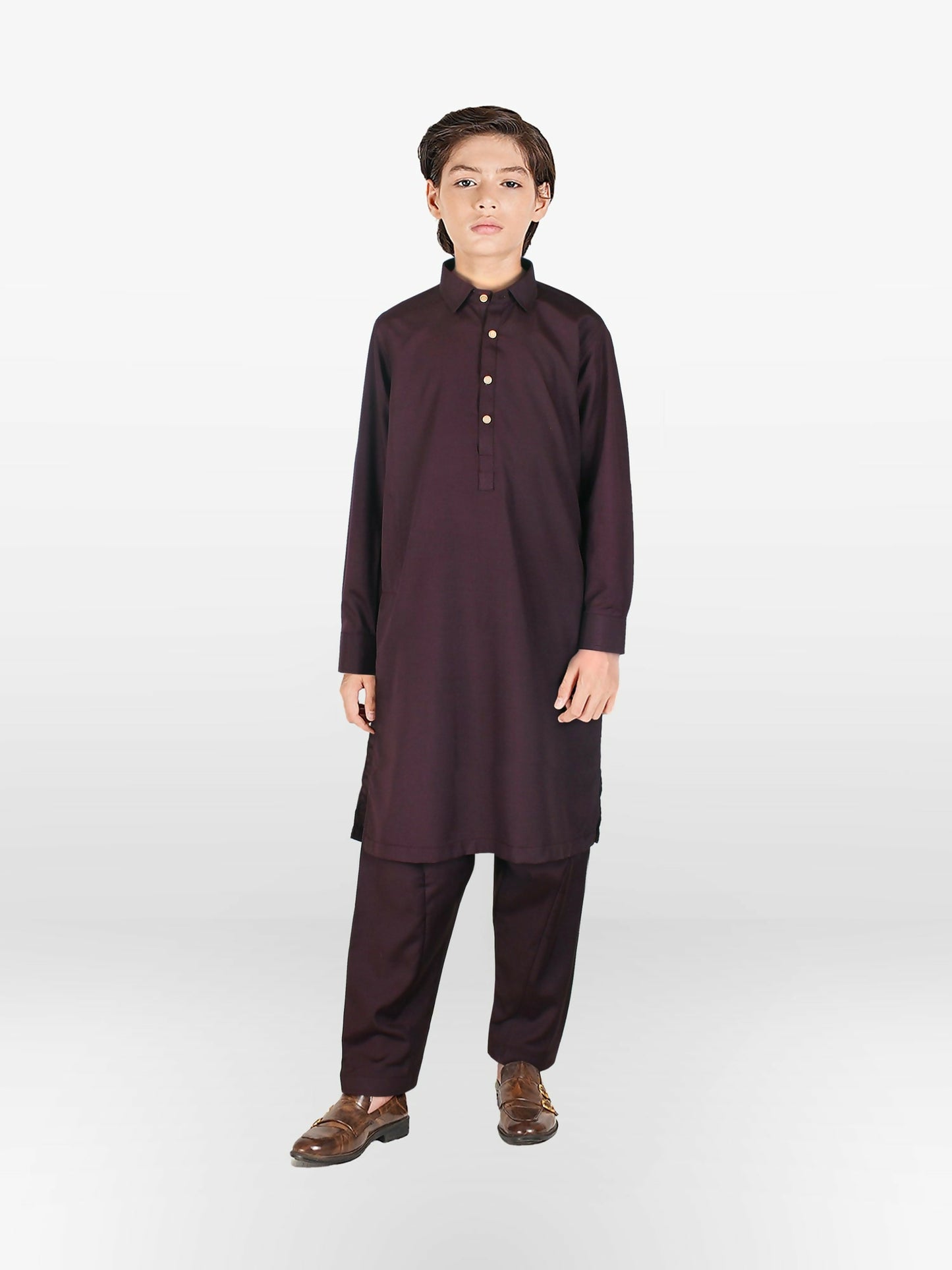 Boy standing and wearing cotton shalwar kameez with front buttons, mandarin collar, full sleeves, and regular fit