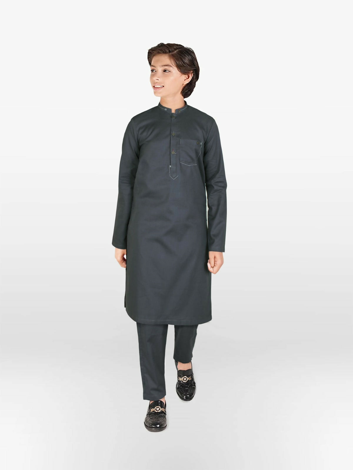 Boy wearing cotton kurta trouser suit with subtle embroidery, mandarin collar, full sleeves, and regular fit