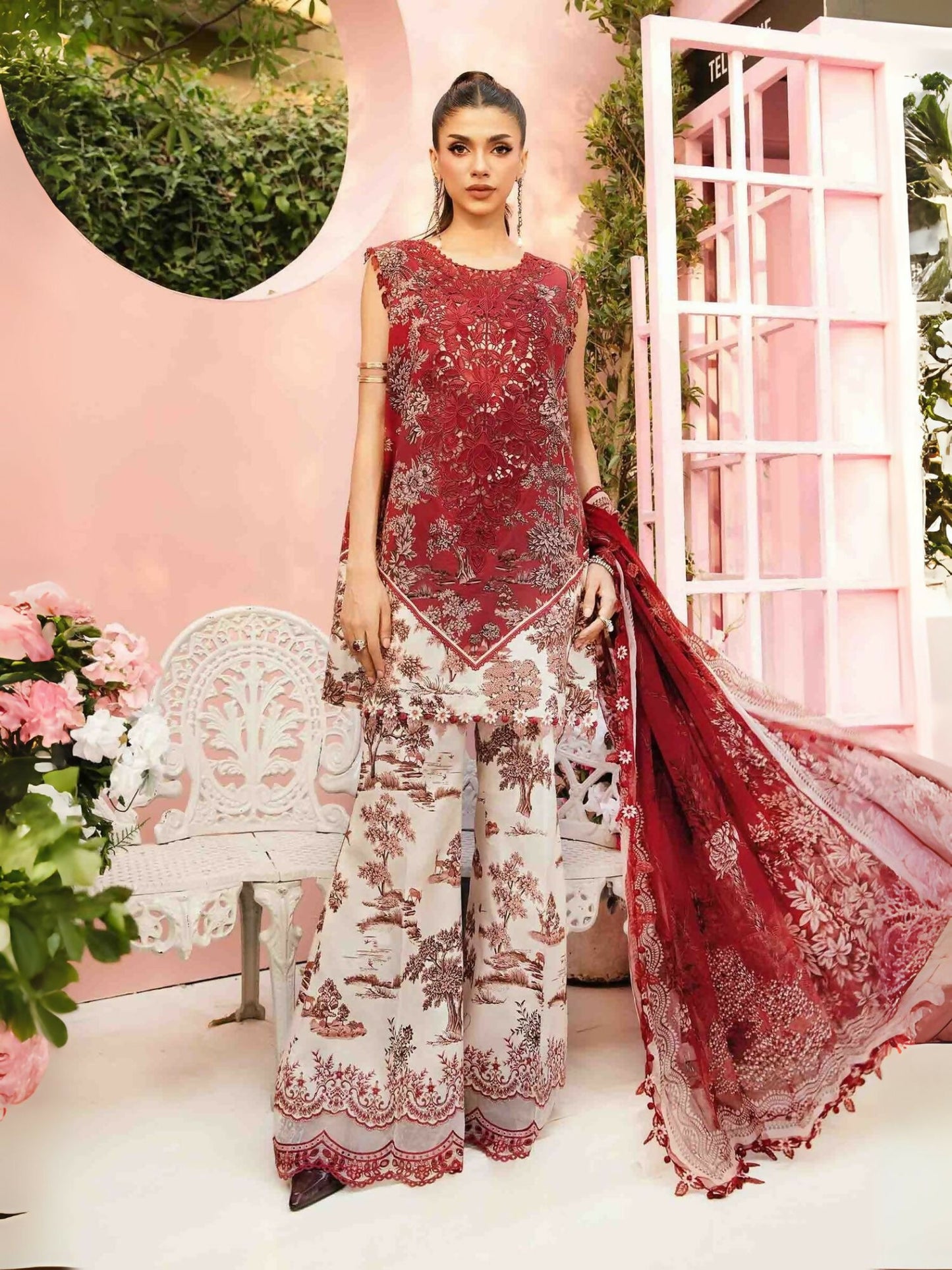 Maria.B printed lawn shirt with embroidered neckline and organza patti, paired with printed cambric trousers and printed chiffon dupatta.