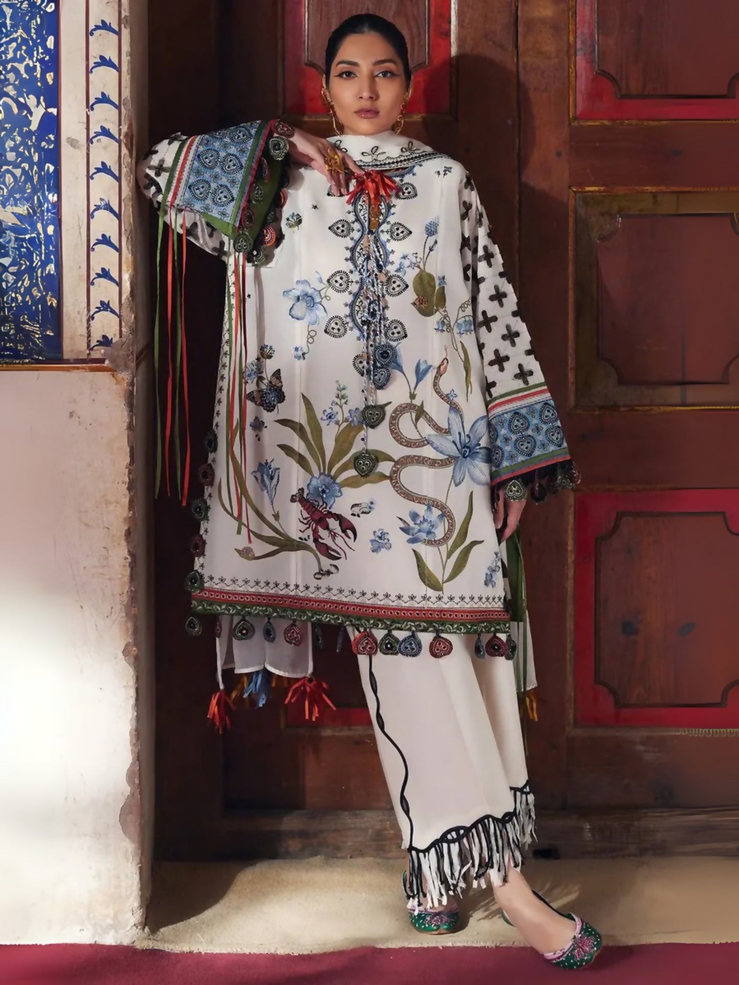Unstitched 3-piece suit by Elan with embroidered lawn shirt, khaddi net embroidered dupatta, and cambric trouser