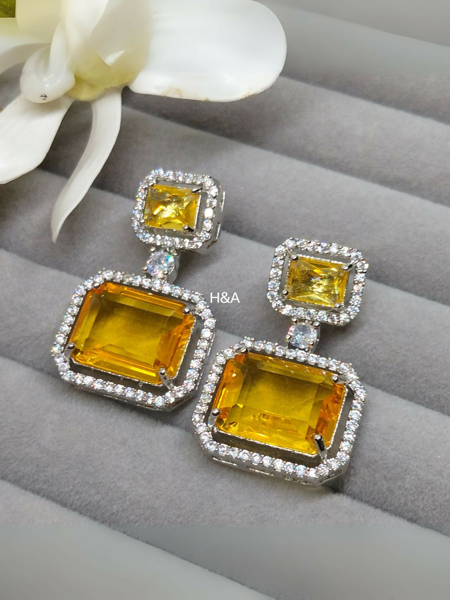 H&A Jewellery one carat earrings with semi-precious stones and American diamonds, elegant and sparkling design.