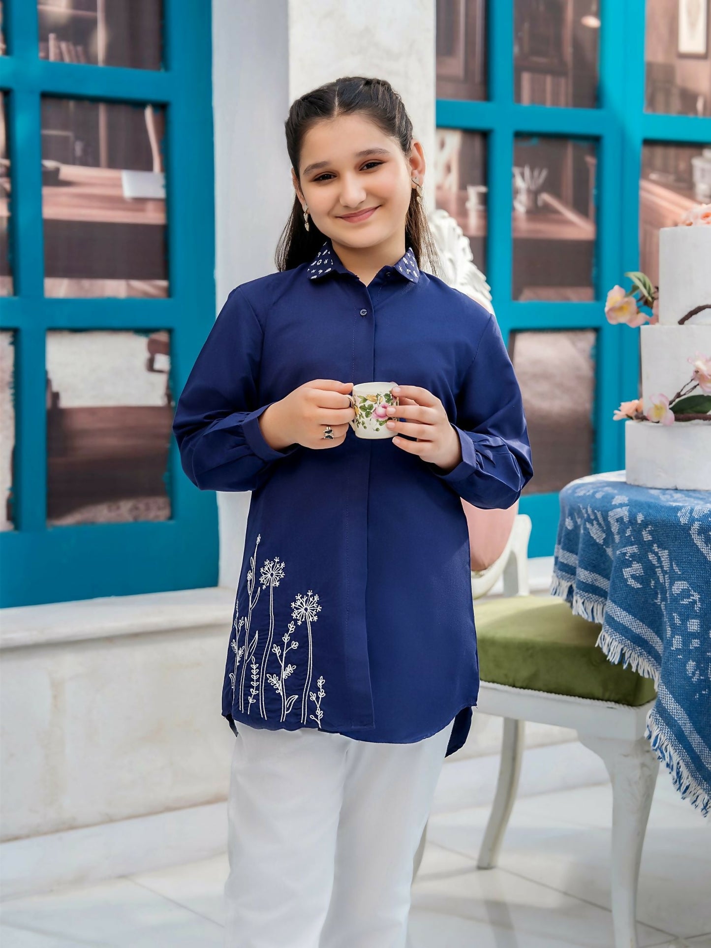Girl wearing a premium intermixed cotton designer tunic with full sleeves and customized fit, perfect for summer casual and festive occasions