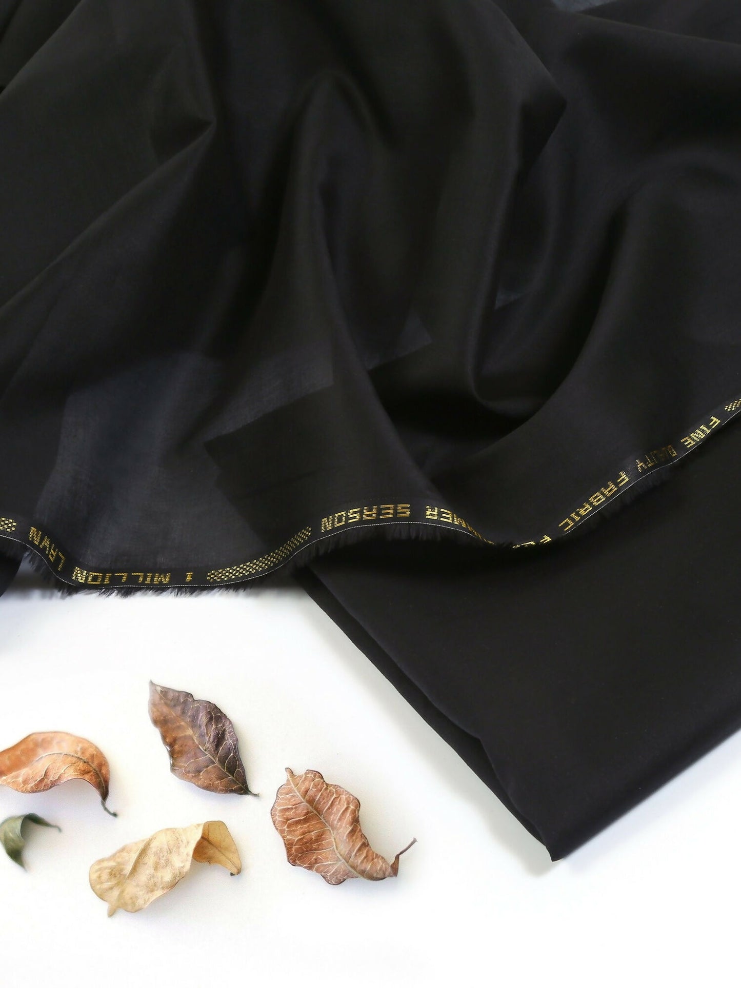 Black unstitched men’s kameez shalwar from Fabrich’s SS'25 collection, featuring 100% lawn for the kameez and soft Pima cotton for the shalwar—designed for breathable summer elegance.