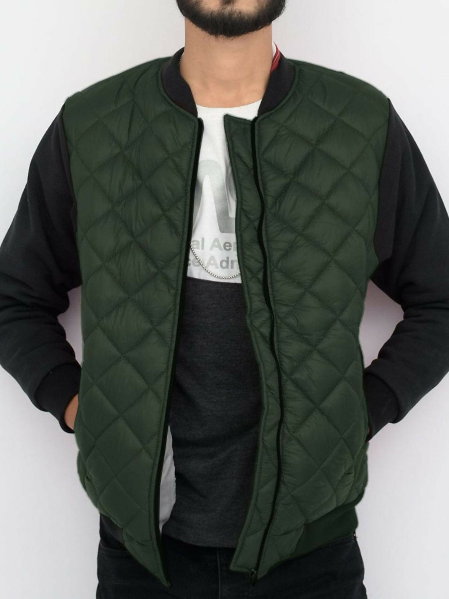 Jupiter puffer bomber jacket with fleece sleeves, ribbed cuffs and bottom, block stitch padding, front zip closure, and multiple pockets. Made with polyester body and cotton-polyester blend sleeves for warmth and comfort