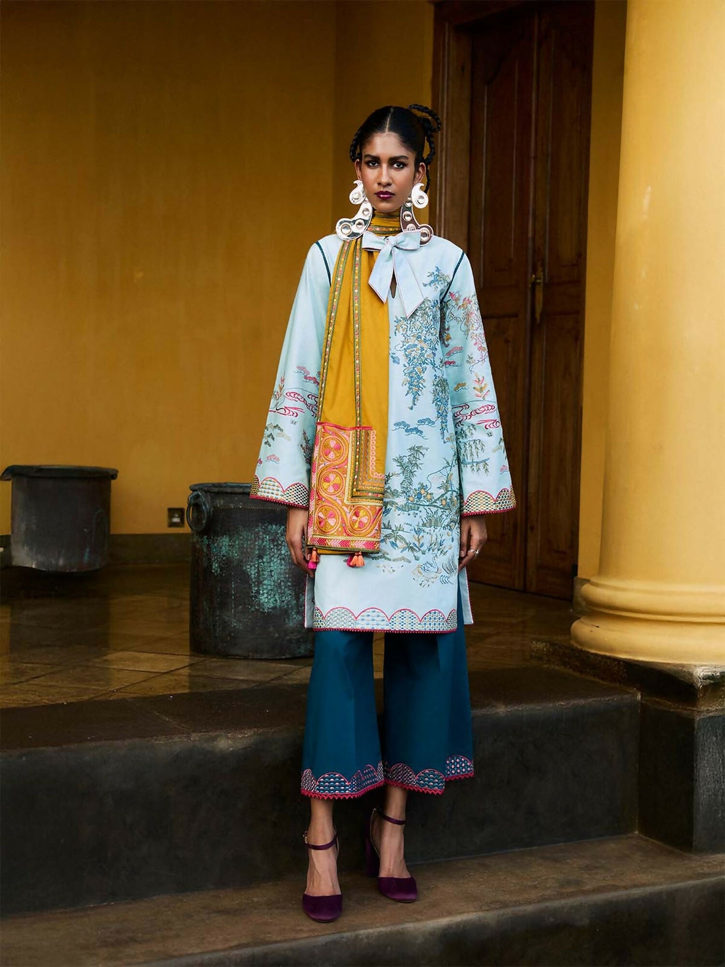 Stitched 2-piece suit by Jugnu by Hussain Rehar with cotton embroidered short shirt, embroidered culottes, and optional multicolor embroidered scarf with tassels.