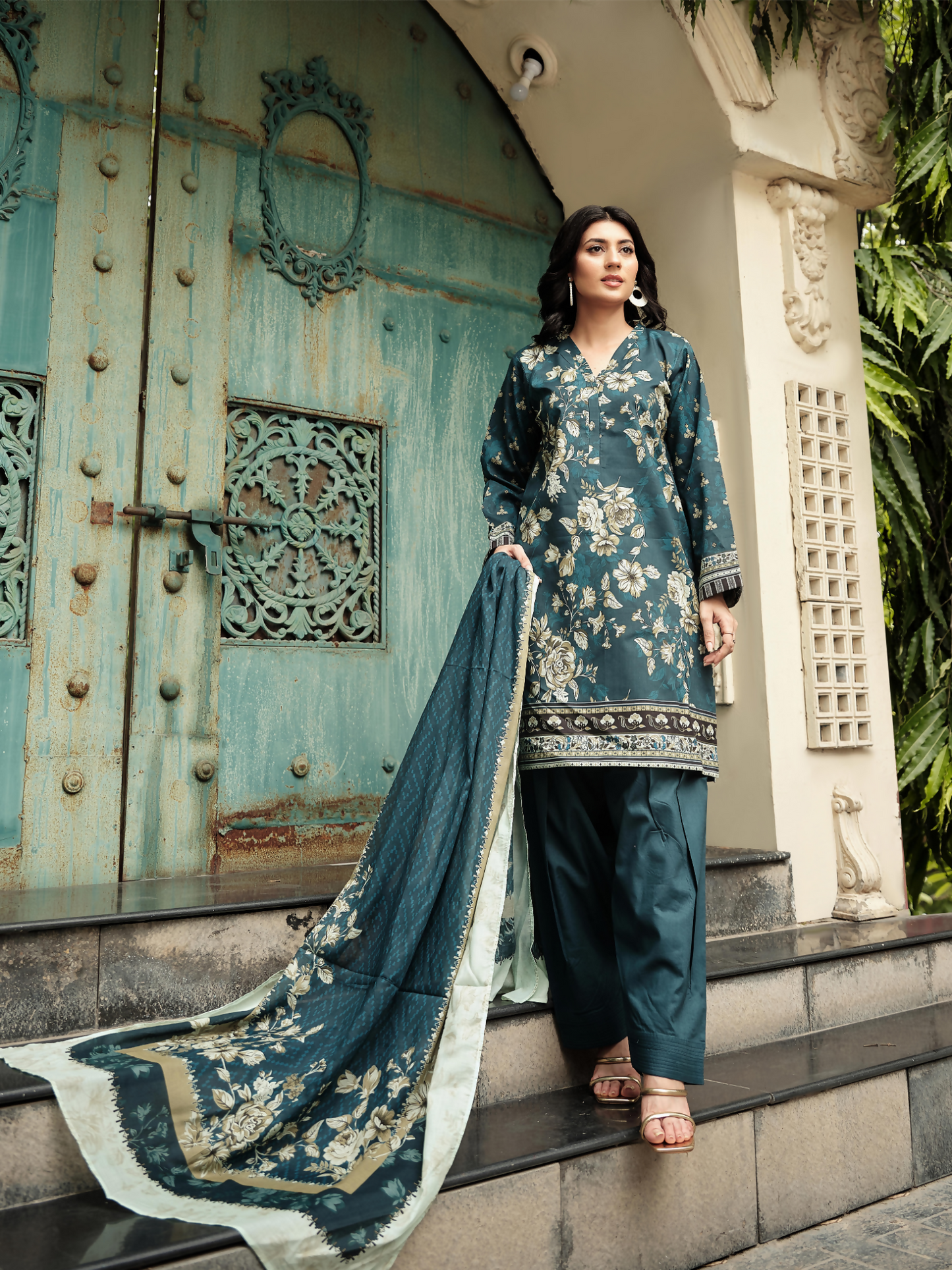 Unstitched 3-piece suit with a dark teal floral printed lawn shirt, coordinating printed dupatta, and matching dyed trouser.