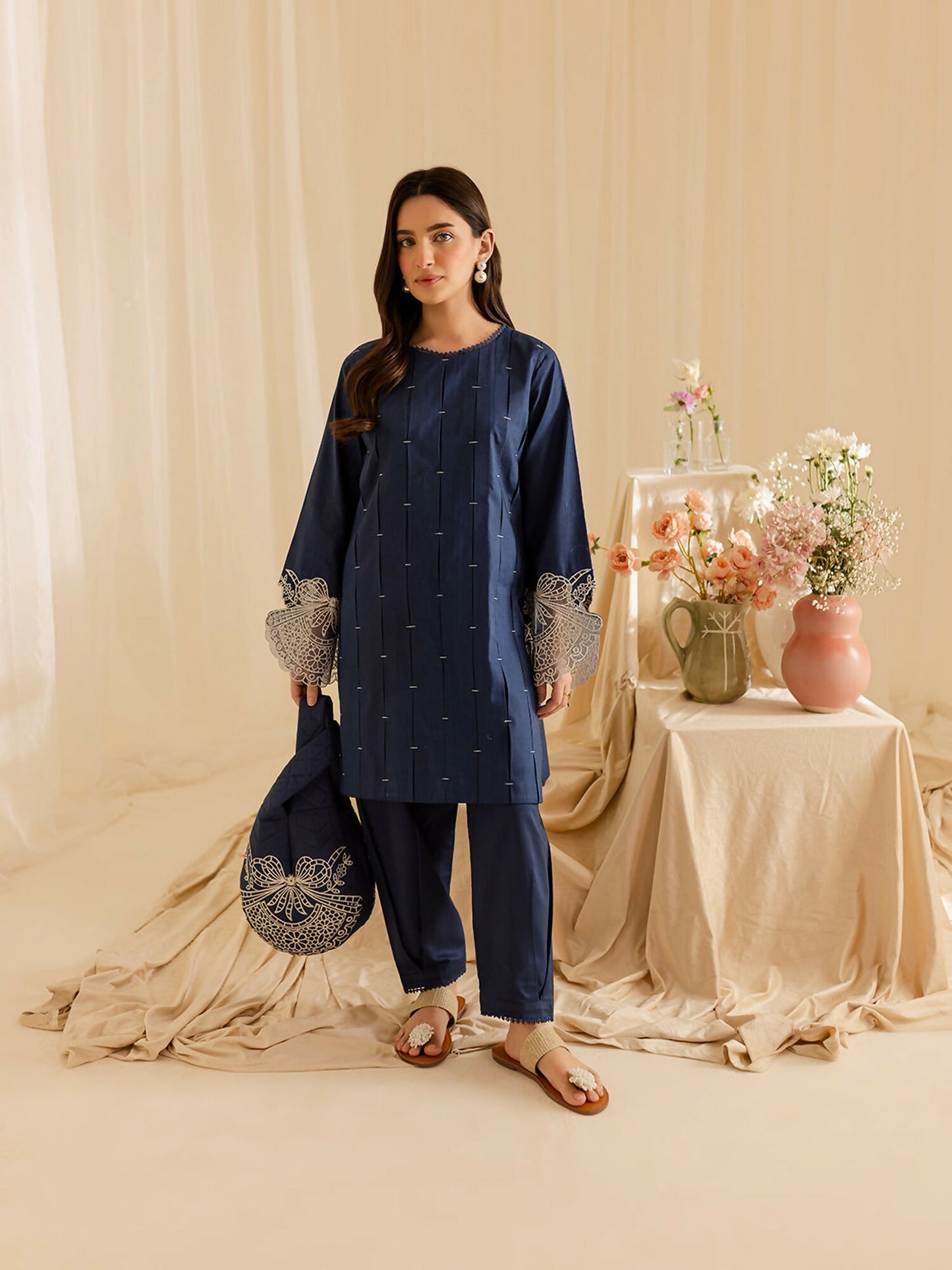 Mahnur stitched 2-piece pret suit featuring a lawn embroidered shirt with classic detailing and full sleeves, paired with a plain trouser.