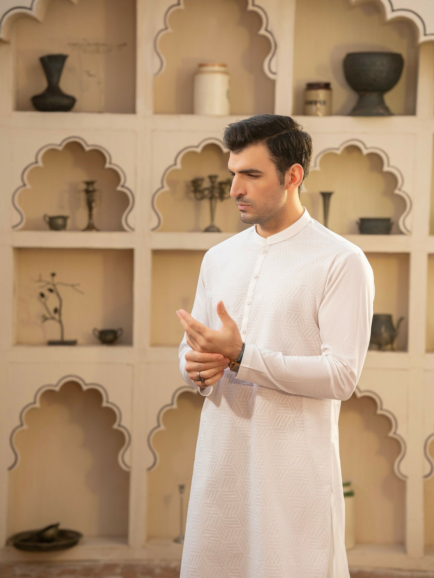 Off-white men’s unstitched kameez shalwar from Miraas by Fabrich, tailored in luxury soft fine 100% cotton with detailed allover cotton-thread embroidery showcasing a signature design pattern — finished with premium designer buttons, brand label, and inlay card.