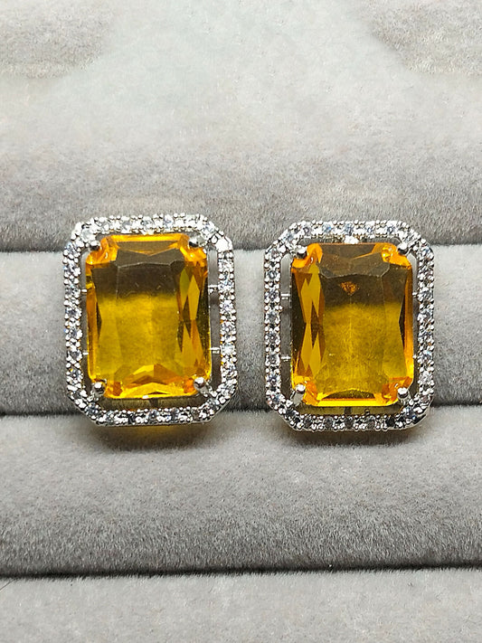 H&A Jewellery stud earrings with rectangular yellow stones surrounded by zircon accents.