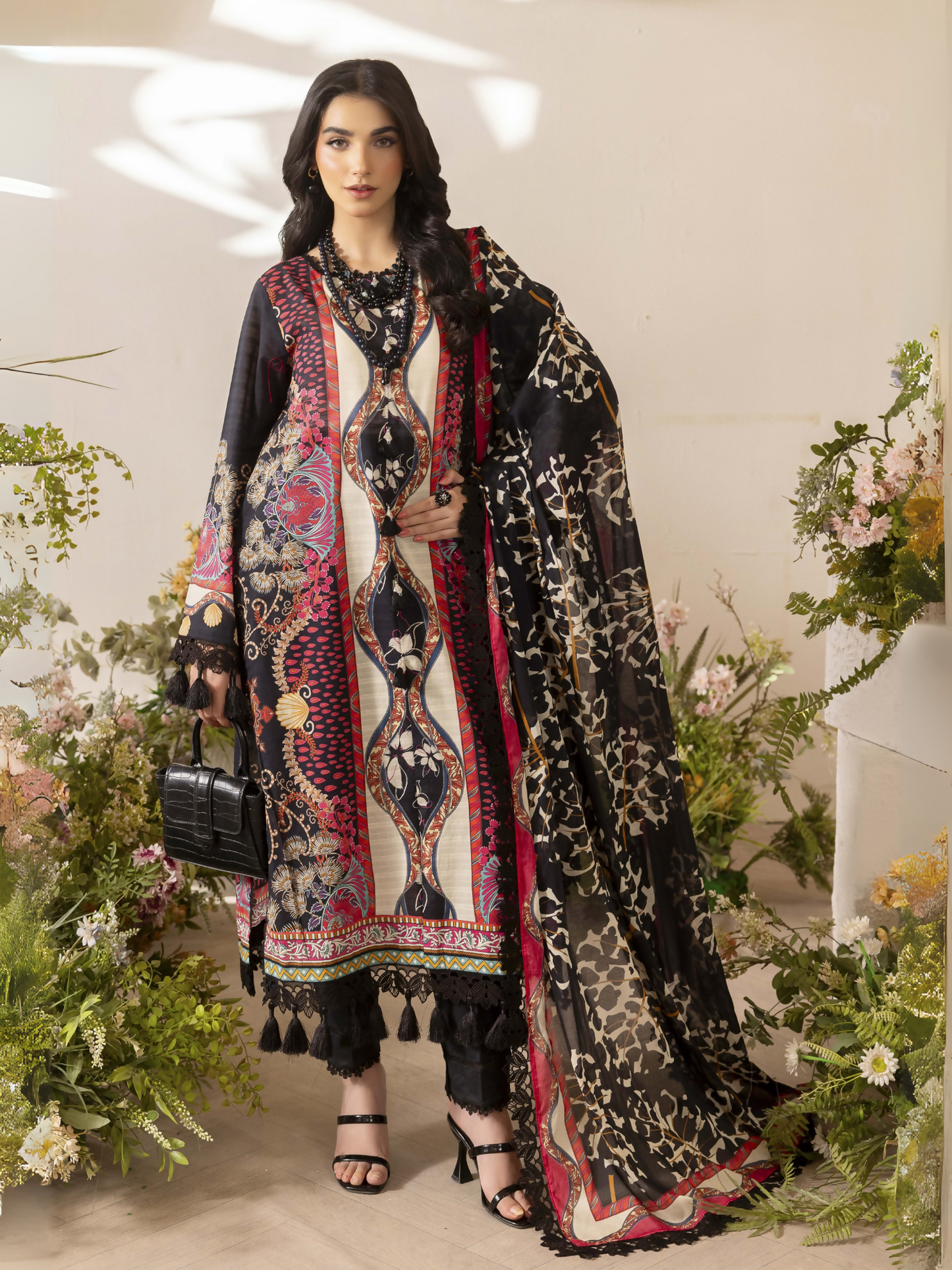 Girl standing wearing an unstitched 3-piece suit with premium digital printed slub lawn shirt, digital printed pure voile dupatta, and dyed cotton trouser, styled for summer comfort and elegance.