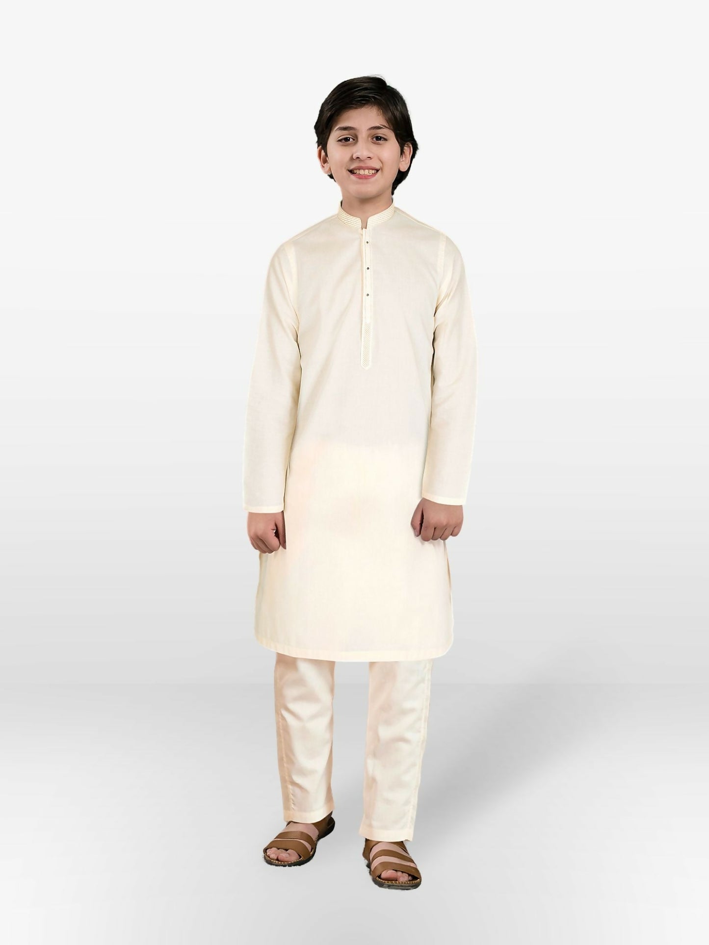 Boy wearing embroidered cotton kurta with matching trouser, featuring mandarin collar, full sleeves, and regular fit stitched 2-piece suit