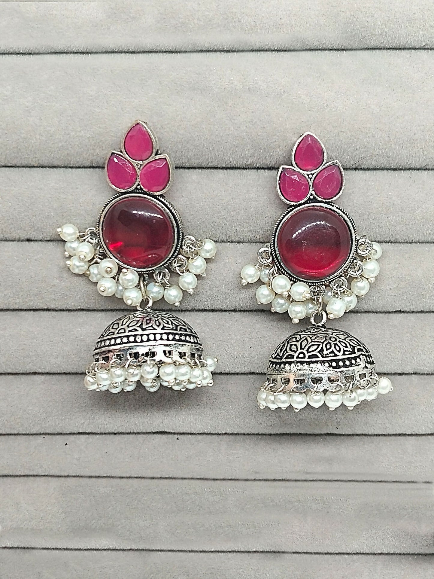 H&A Jewellery oxidized silver dome-shaped jhumka earrings with pink stones and pearl drops