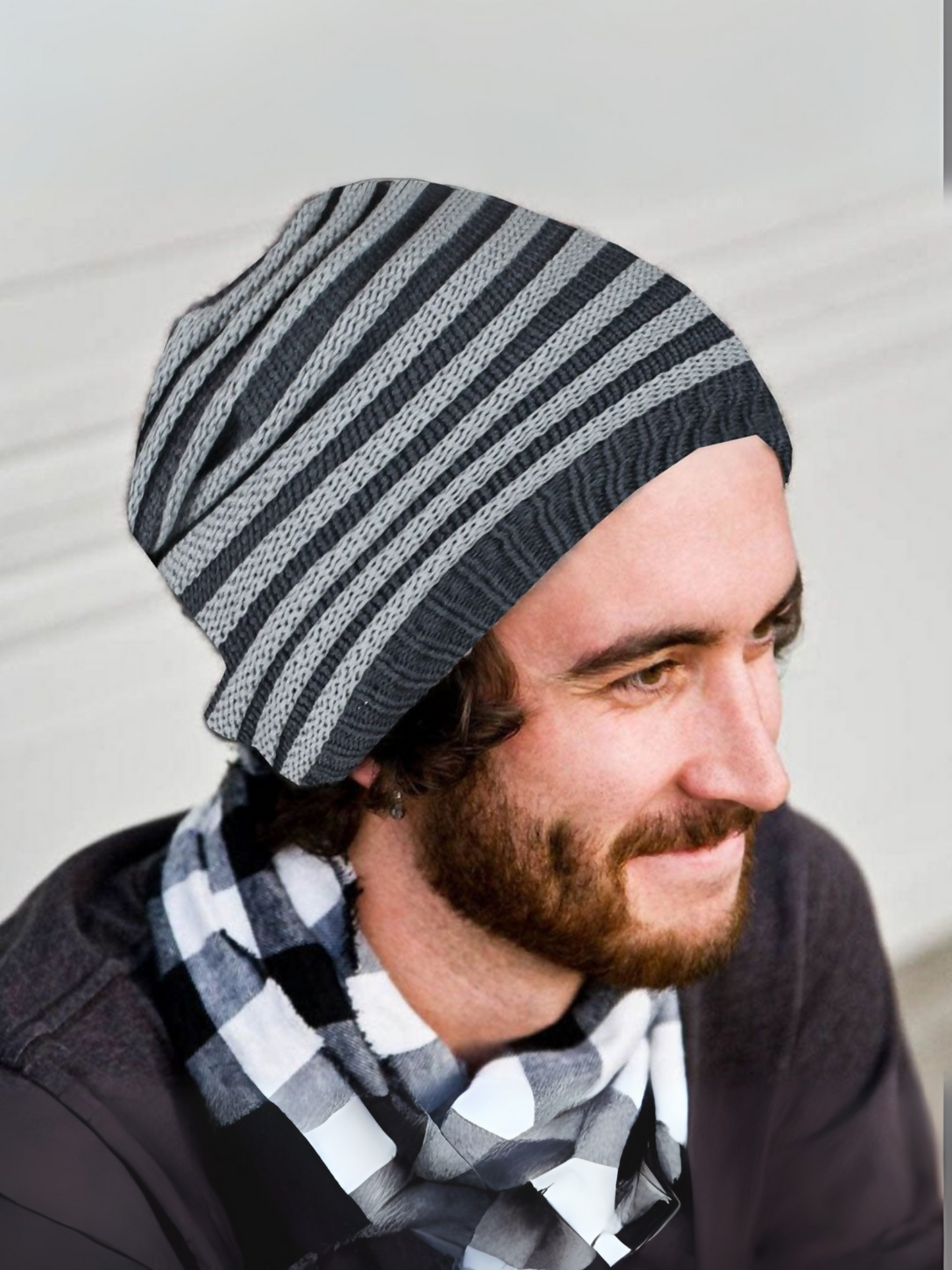Grey and black striped woolen beanie with a stretchable fit and warm inner lining, perfect for cold weather.