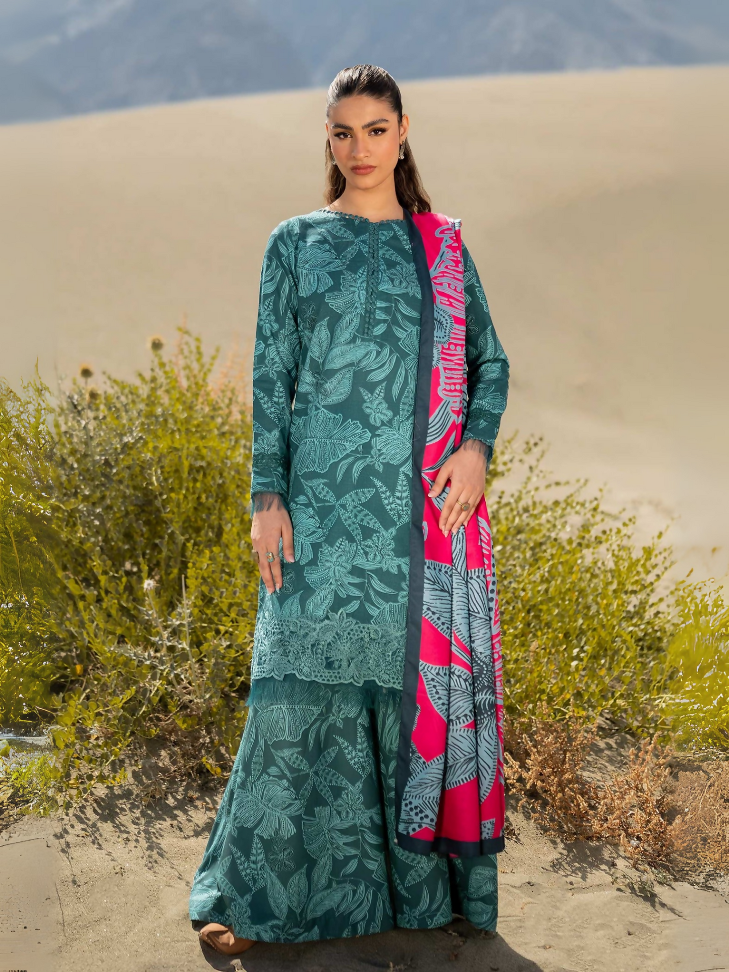 Unstitched 3-piece suit by Maria B with digital printed khaddar shirt and trouser, embroidered organza patti, and digital printed herringbone shawl.