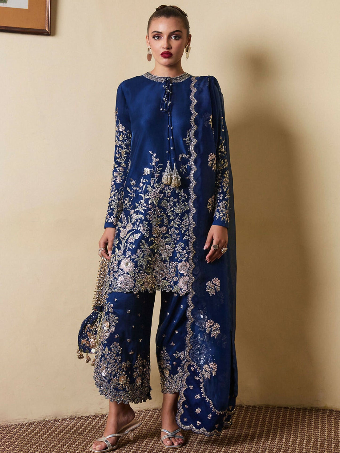 Hussain Rehar navy blue raw silk embroidered shirt with hand embellishments, side slit raw silk shalwar, and scalloped organza dupatta with tassel detail