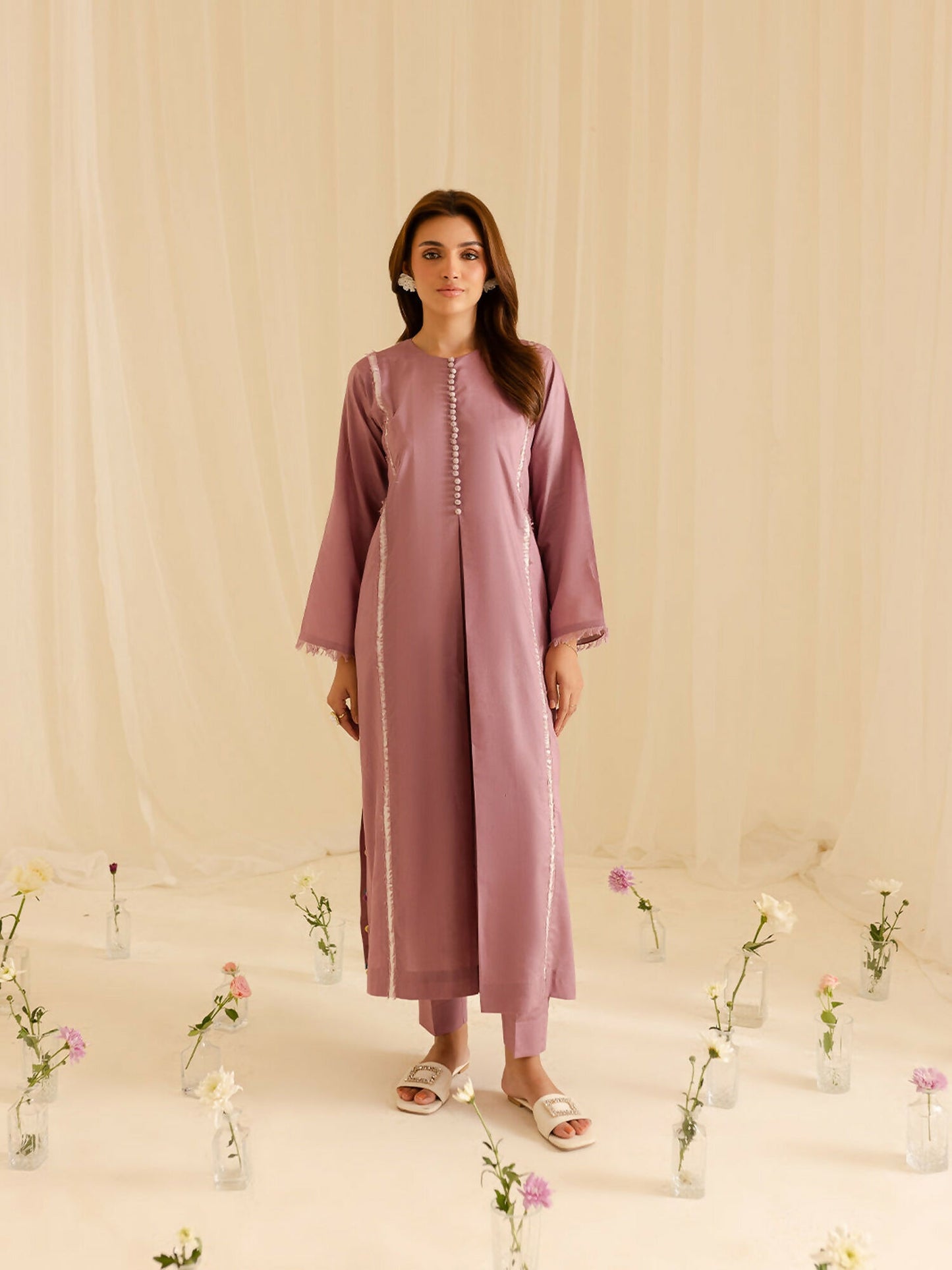 Mahnur Liliosa 2-piece stitched pret suit with long shirt featuring elegant detailing and plain trouser.