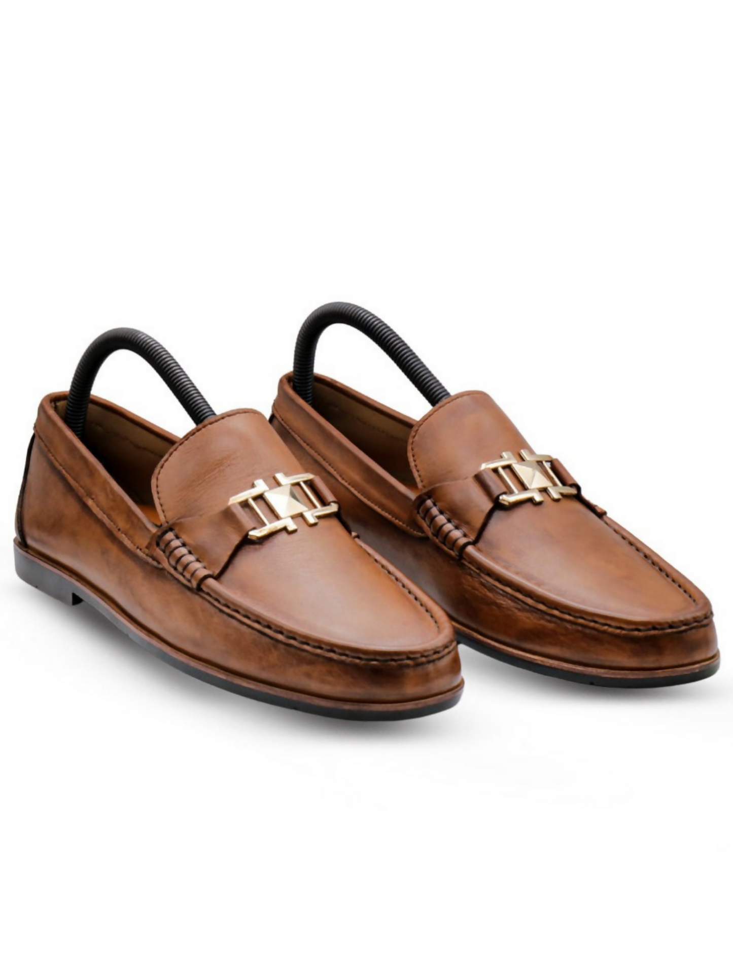 Premium leather loafers featuring a bold crest-style buckle, blending classic elegance with a modern, powerful look.