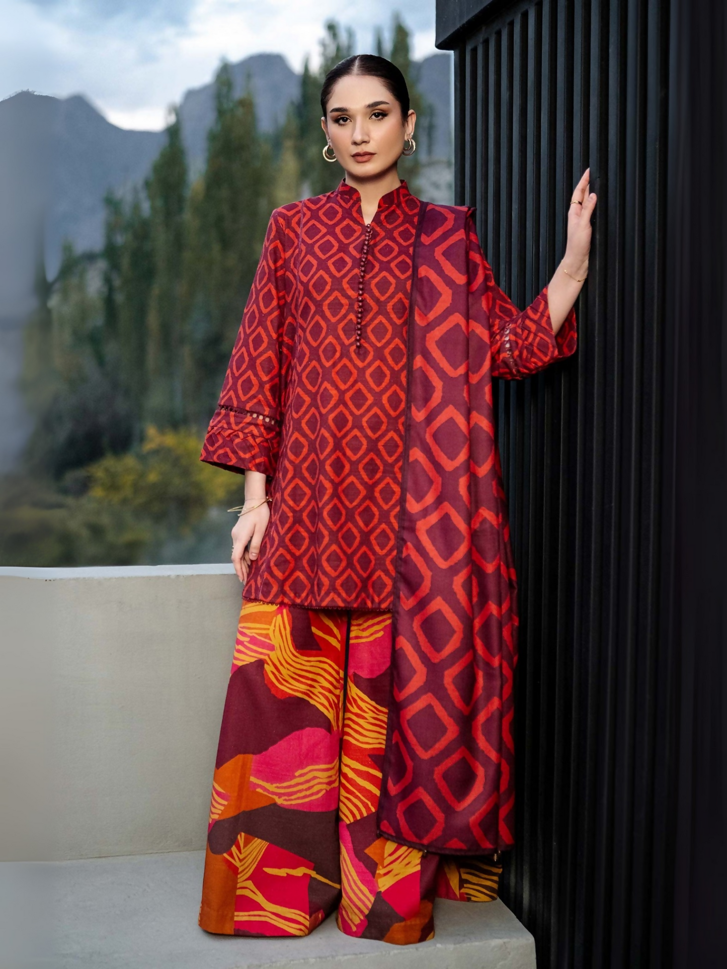 Unstitched 3-piece suit by Maria B with digital printed khaddar shirt and trouser, and digital printed herringbone shawl.
