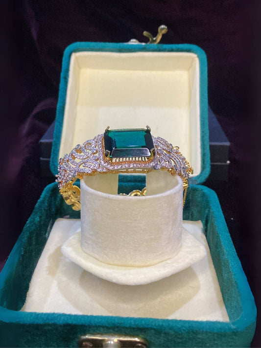 Noor Bilal openable gold plated bracelet with green stone center, stylish and elegant jewellery piece