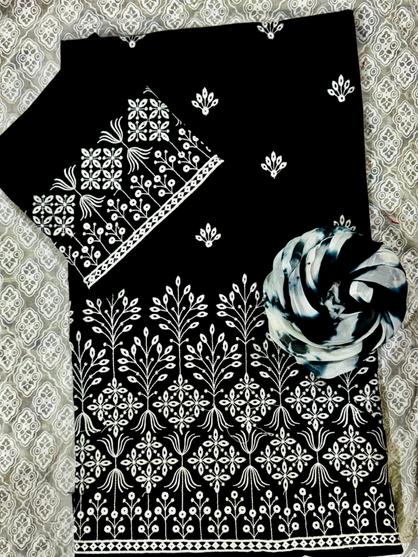 Fehm unstitched black lawn 2-piece suit with embroidered front motifs, plain back, embroidered sleeves, and tie-and-dye lawn dupatta.