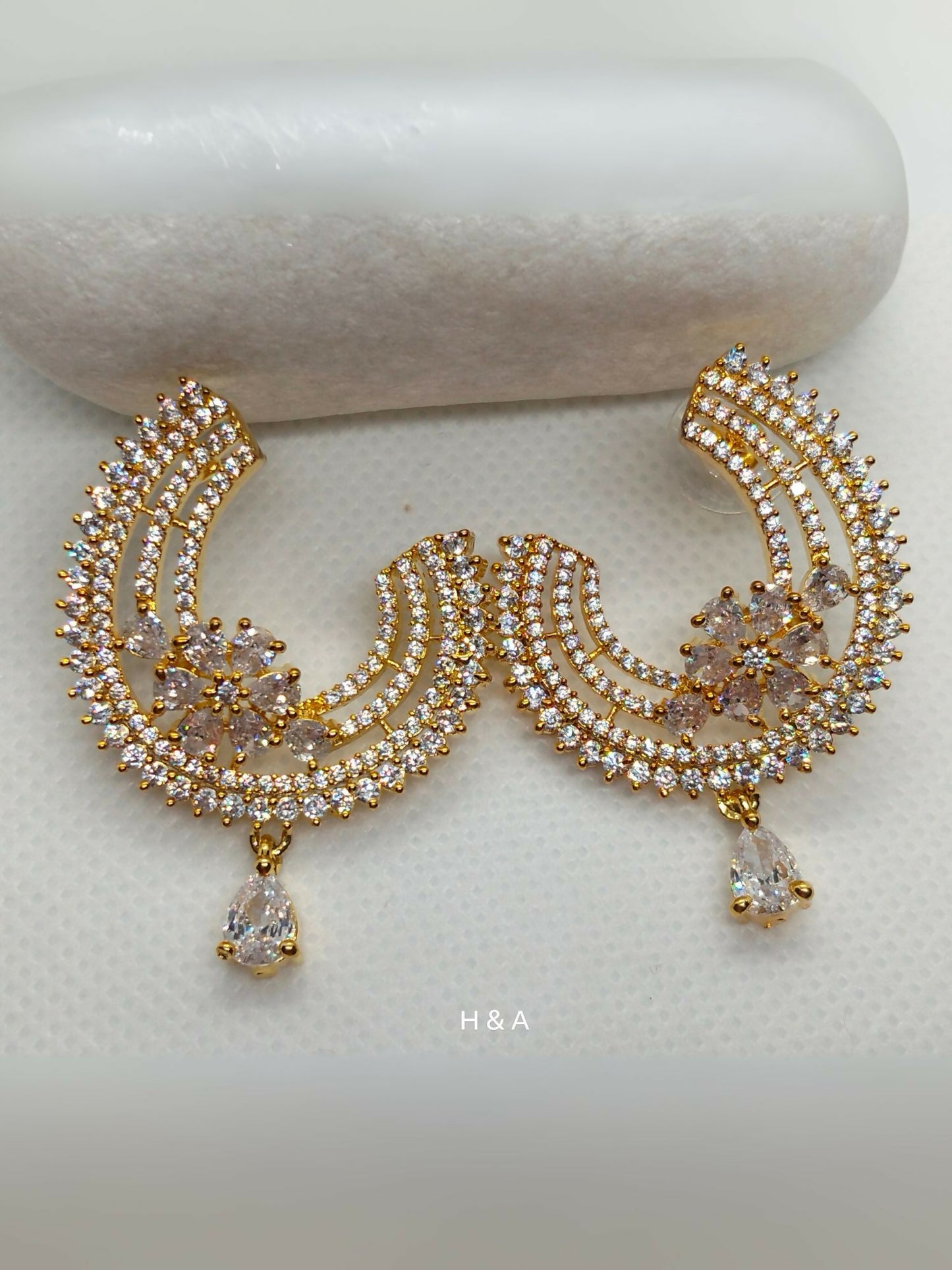 H&A Jewellery one carat earrings adorned with real zircon stones.