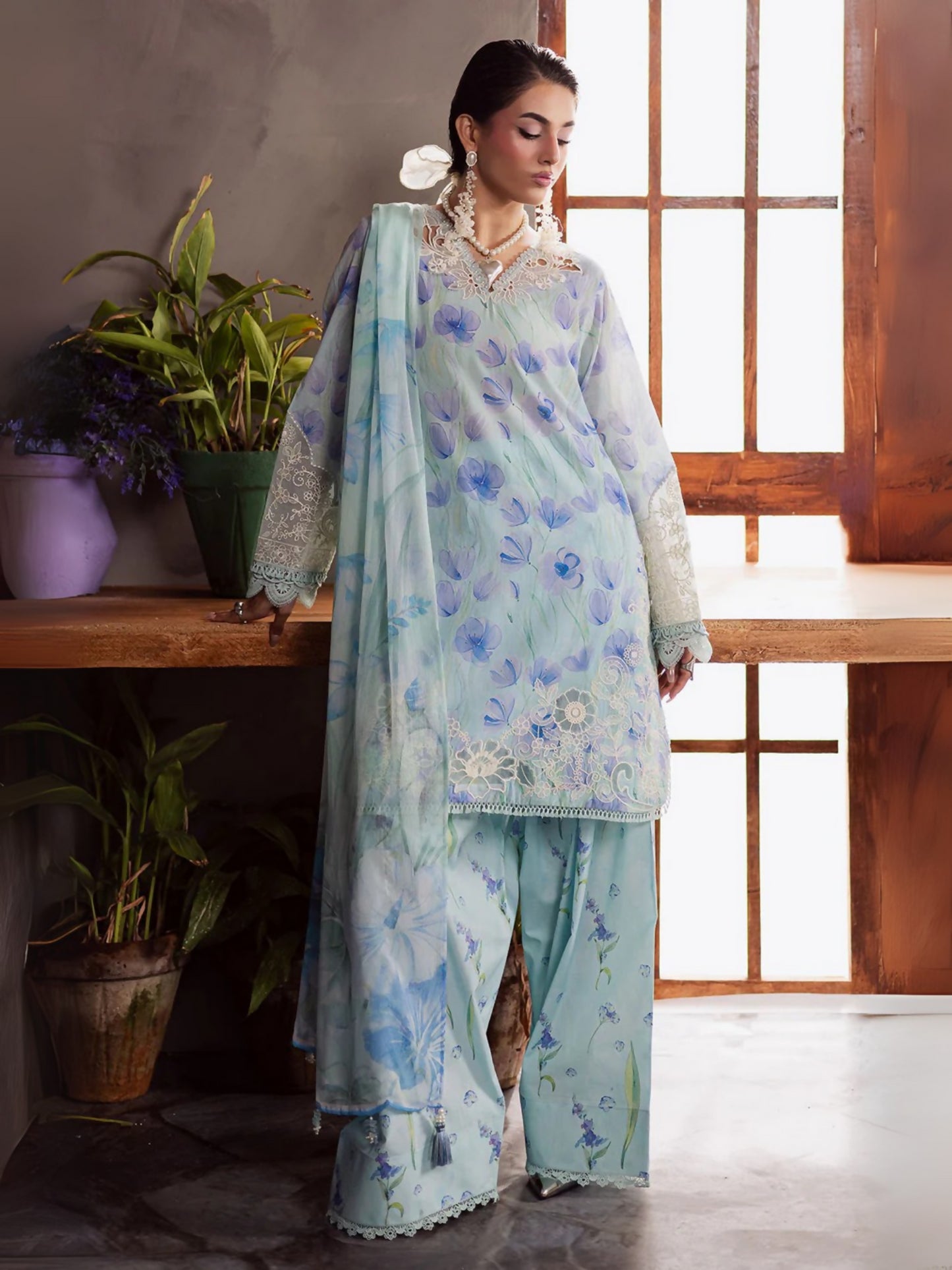 Nureh unstitched 3-piece suit with printed and embroidered chikankari lawn shirt, printed chiffon dupatta, and dyed cotton farshi shalwar.