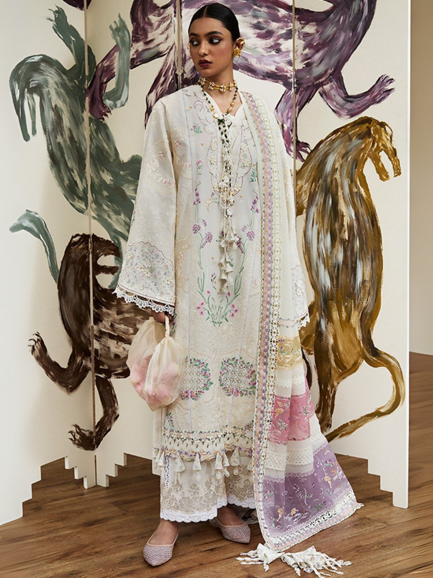 Off-white embroidered lawn unstitched 3-piece suit by Zoha by Ansab Jahangir with organza patches, chiffon dupatta with embroidered borders, and cambric trouser.
