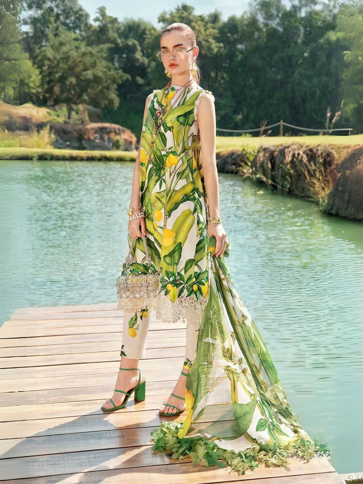 Maria.B white and yellow printed embroidered lawn shirt with organza patti, printed cambric trouser, and printed chiffon dupatta.