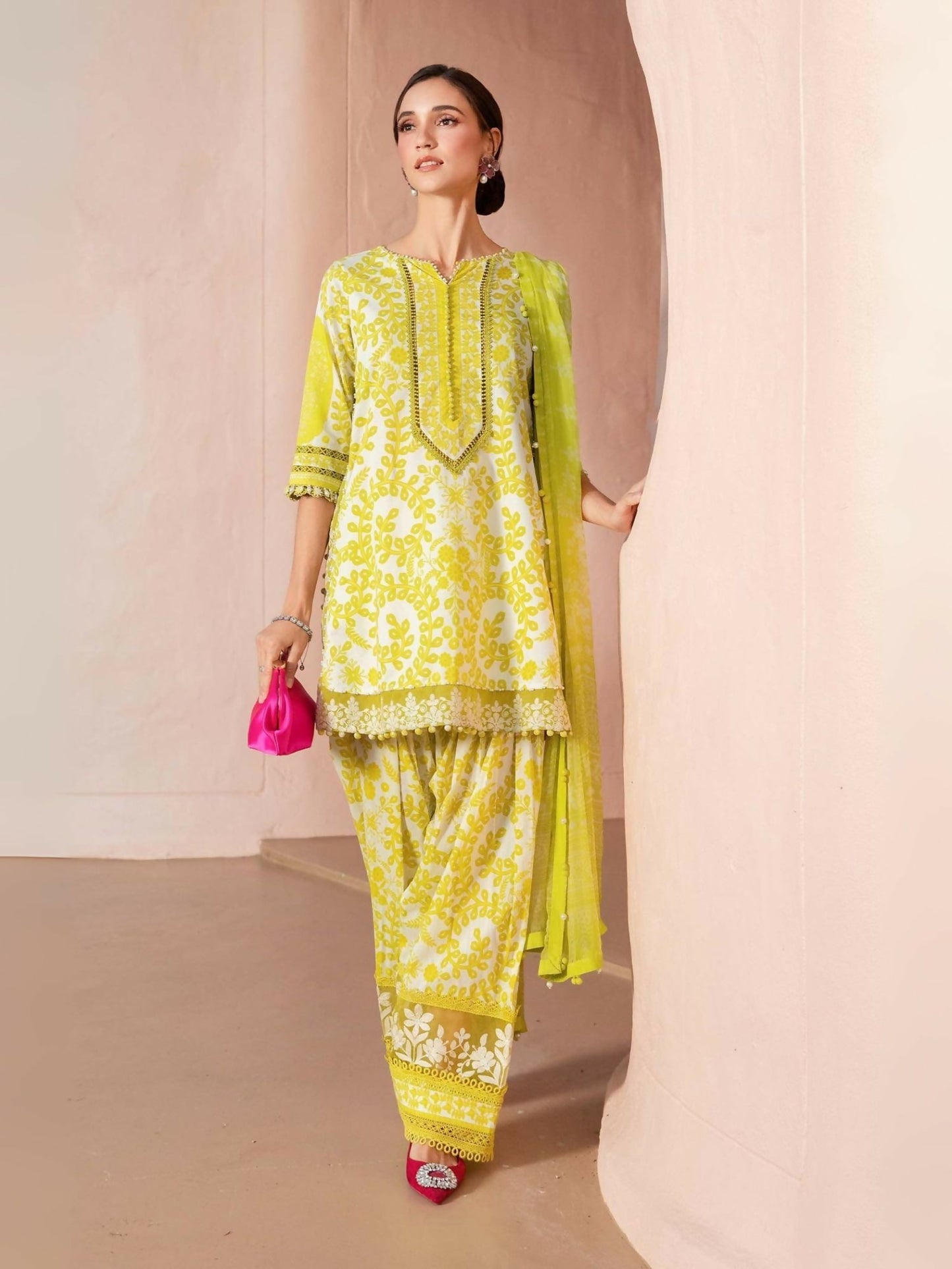 Maria.B white and yellow printed lawn shirt with dual embroidered pattis, printed cambric trouser, and printed chiffon dupatta.