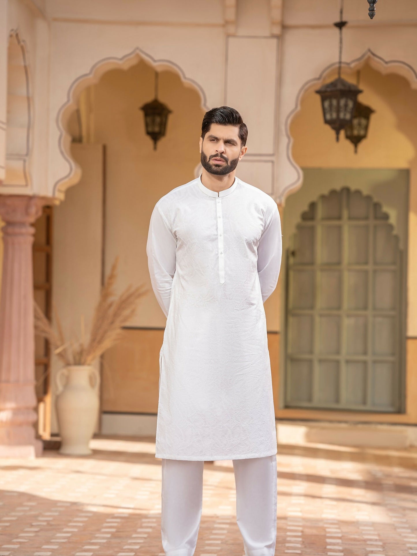 Off-white men’s unstitched kameez shalwar from the Miraas Collection by Fabrich, made from luxury soft fine 100% cotton, featuring allover cotton-thread embroidery with signature pattern and design — complemented with designer buttons and branded add-ons.