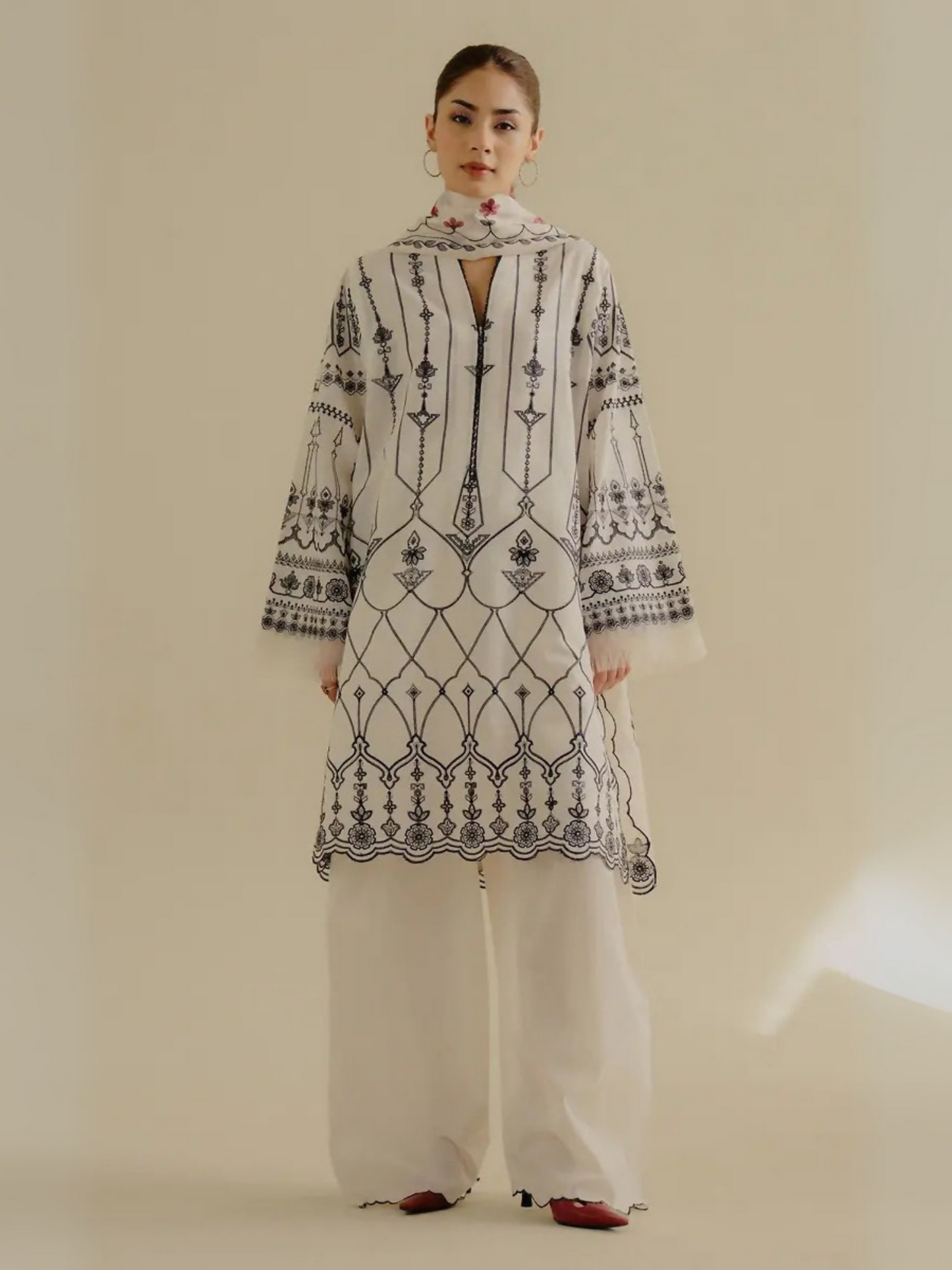 Unstitched 3-piece embroidered suit with fully embroidered lawn shirt, dyed cambric trouser, and embroidered paper cotton dupatta with separate pallu pieces.