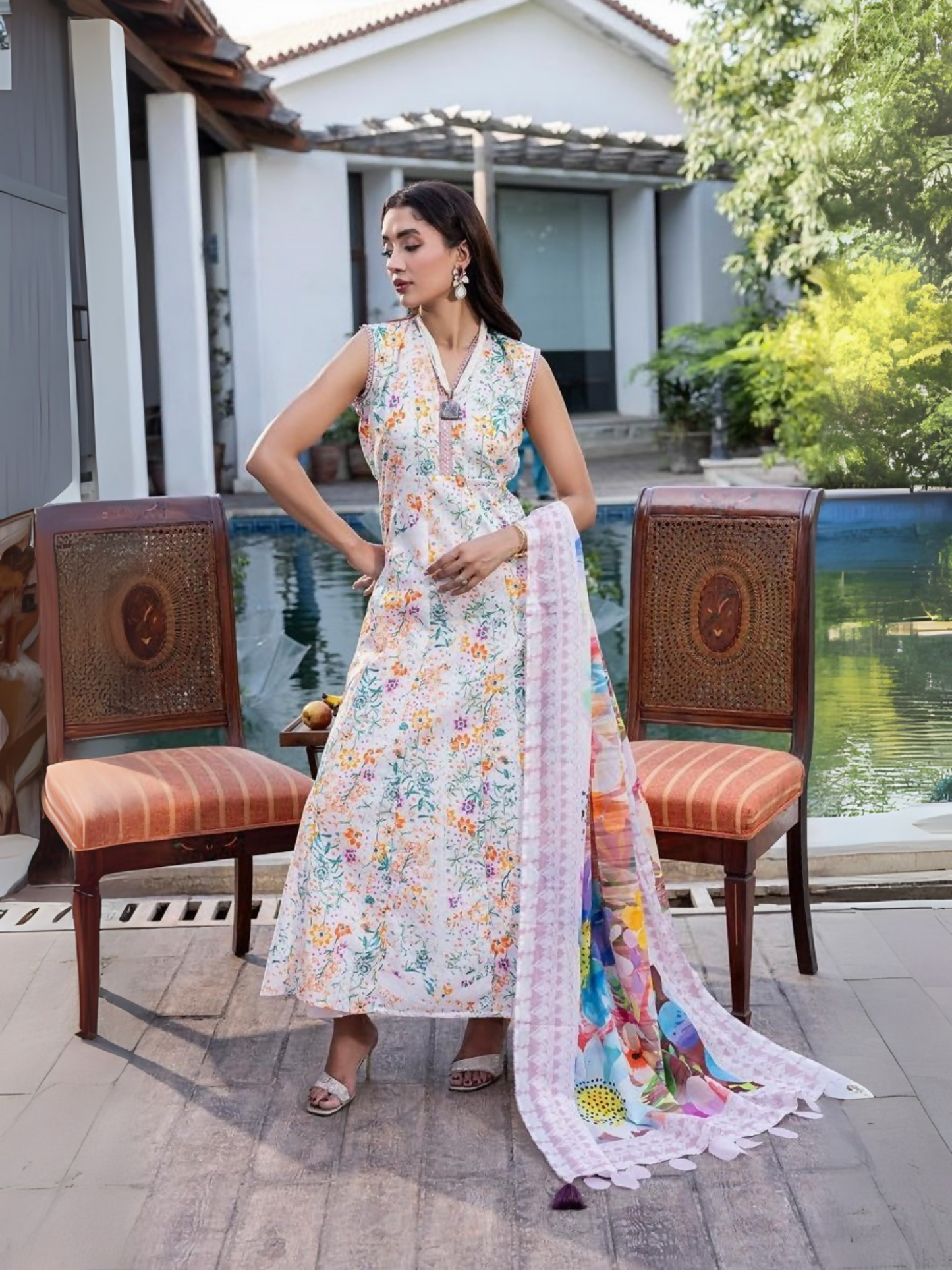 Unstitched 3-piece suit with printed lawn shirt, printed dobby voil dupatta, and dyed cotton trouser, perfect for elegant summer wear.