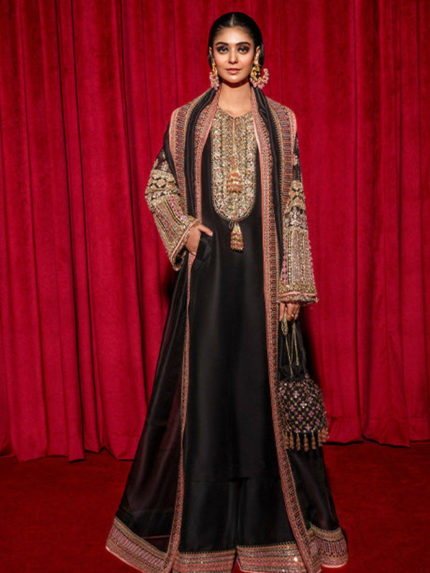 Black raw silk 3-piece suit with embellished long shirt, palazzo pants, and organza dupatta – Hussain Rehar.