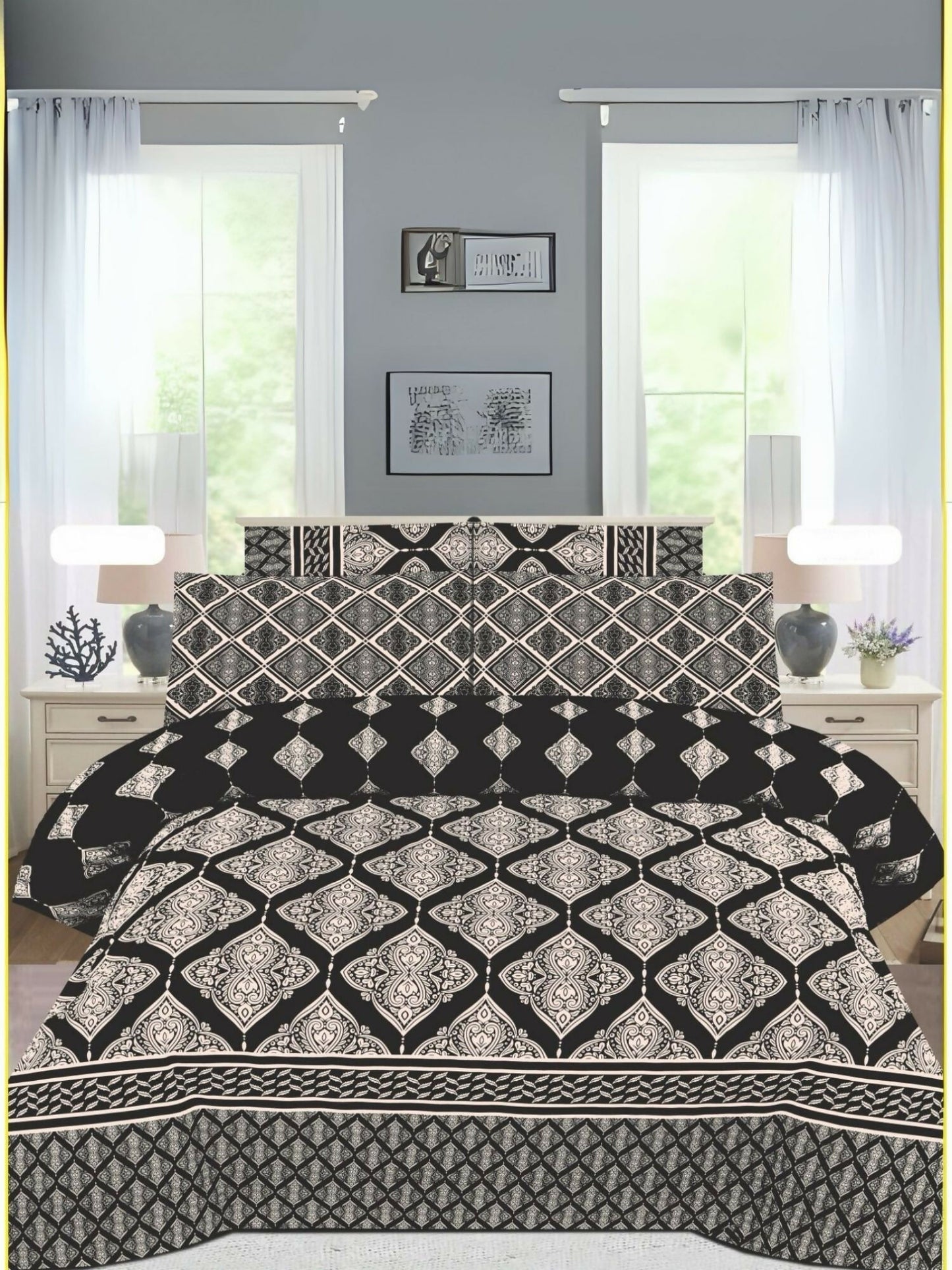 A black king-size bedsheet set with elegant white design patterns, paired with matching pillow covers, neatly spread on a bed.