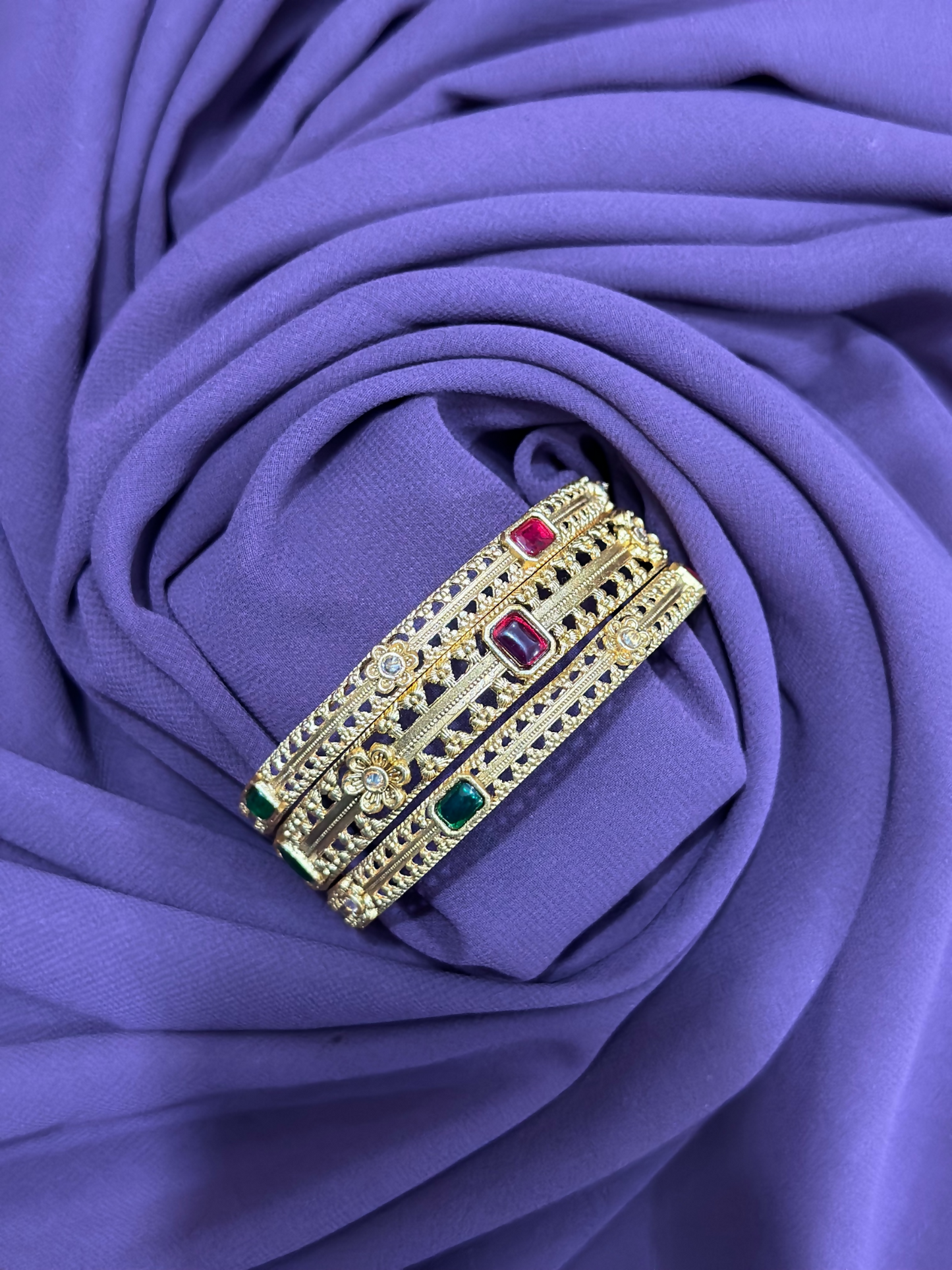 Set of three antique-style bangles with multicolor stones, crystal embellishments, and intricate motif accents – traditional jewellery piece from Glitter Jewellery.