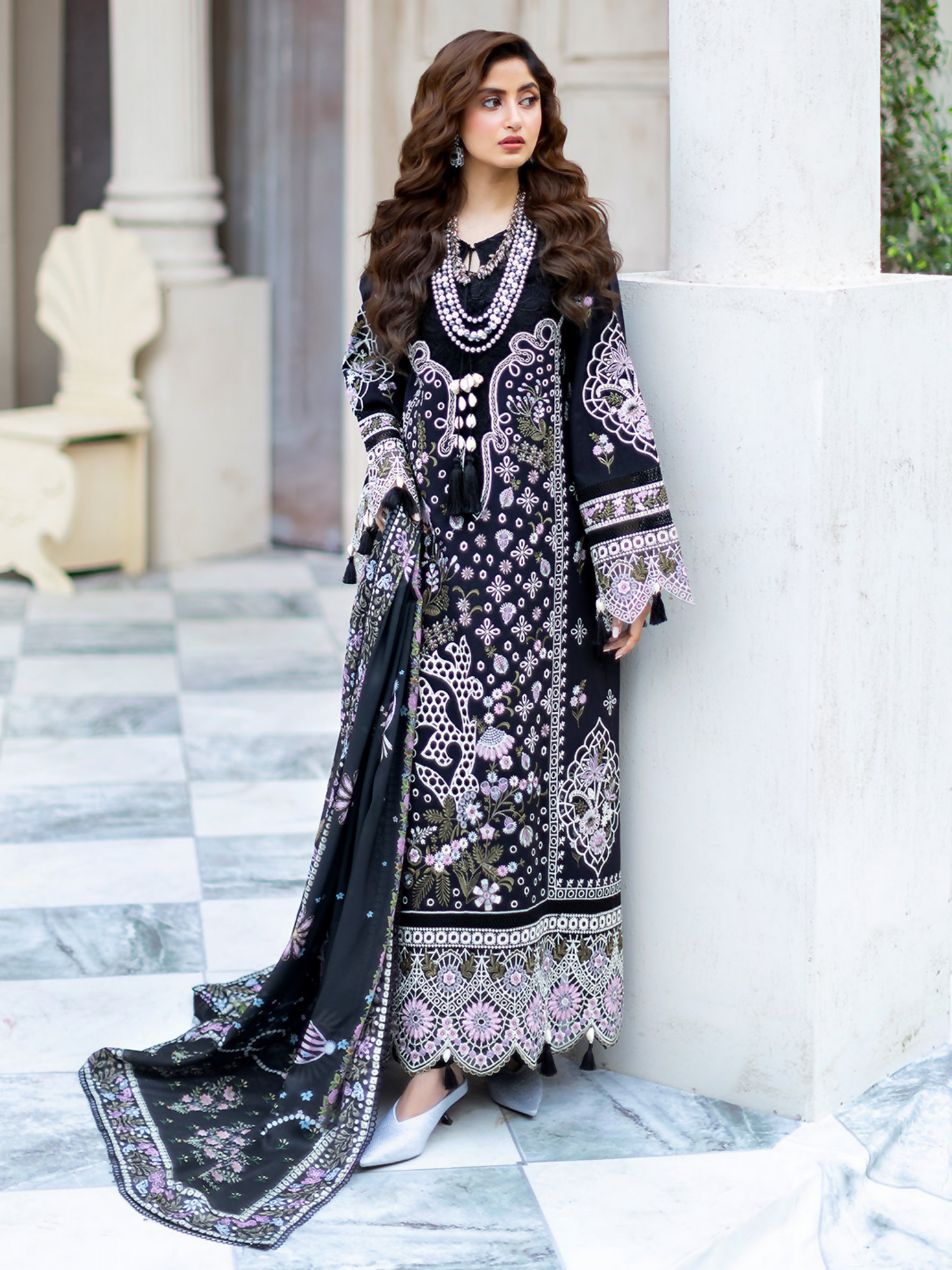 Unstitched 3-piece embroidered suit featuring embroidered lawn front, embroidered back and sleeves, embroidered sleeve motifs and borders, silk printed dupatta, dyed slip, and trouser.