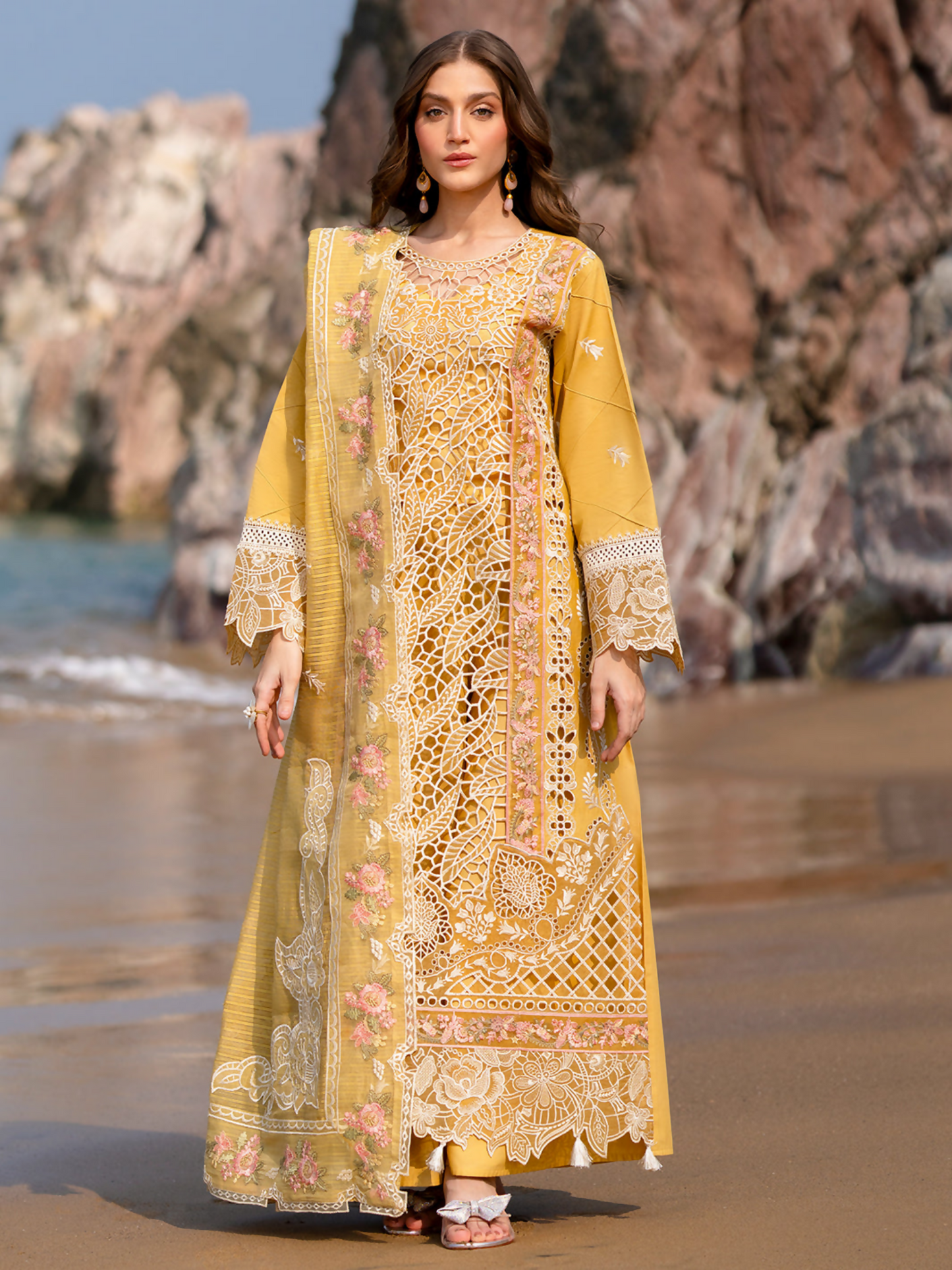 Unstitched 3-piece suit with embroidered lawn shirt, Monark embroidered dupatta, dyed trouser, and lining—adorned with embroidered neckline and borders.