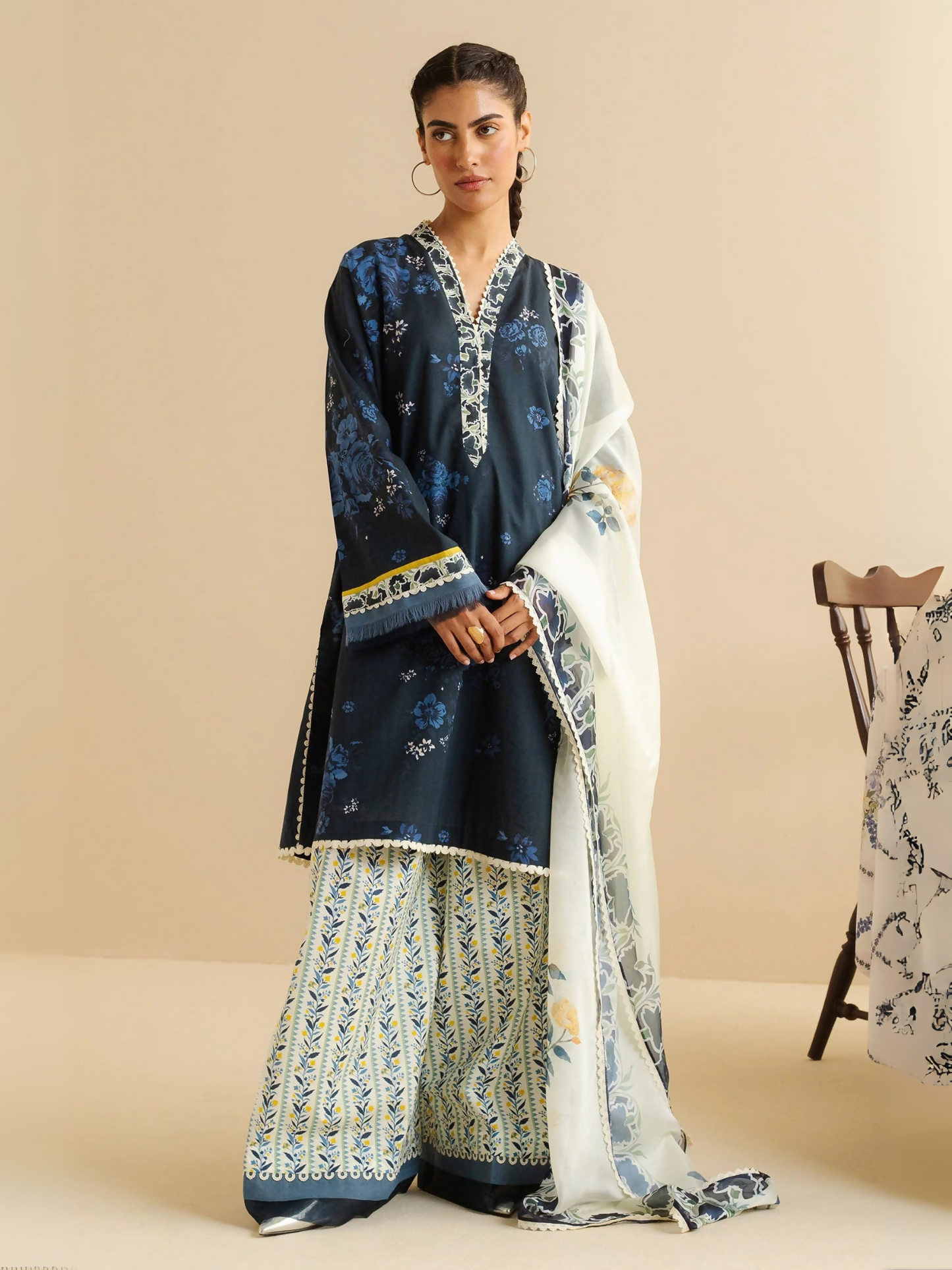 Unstitched 3-piece printed suit with floral lawn shirt, cambric trouser, and printed silk dupatta.