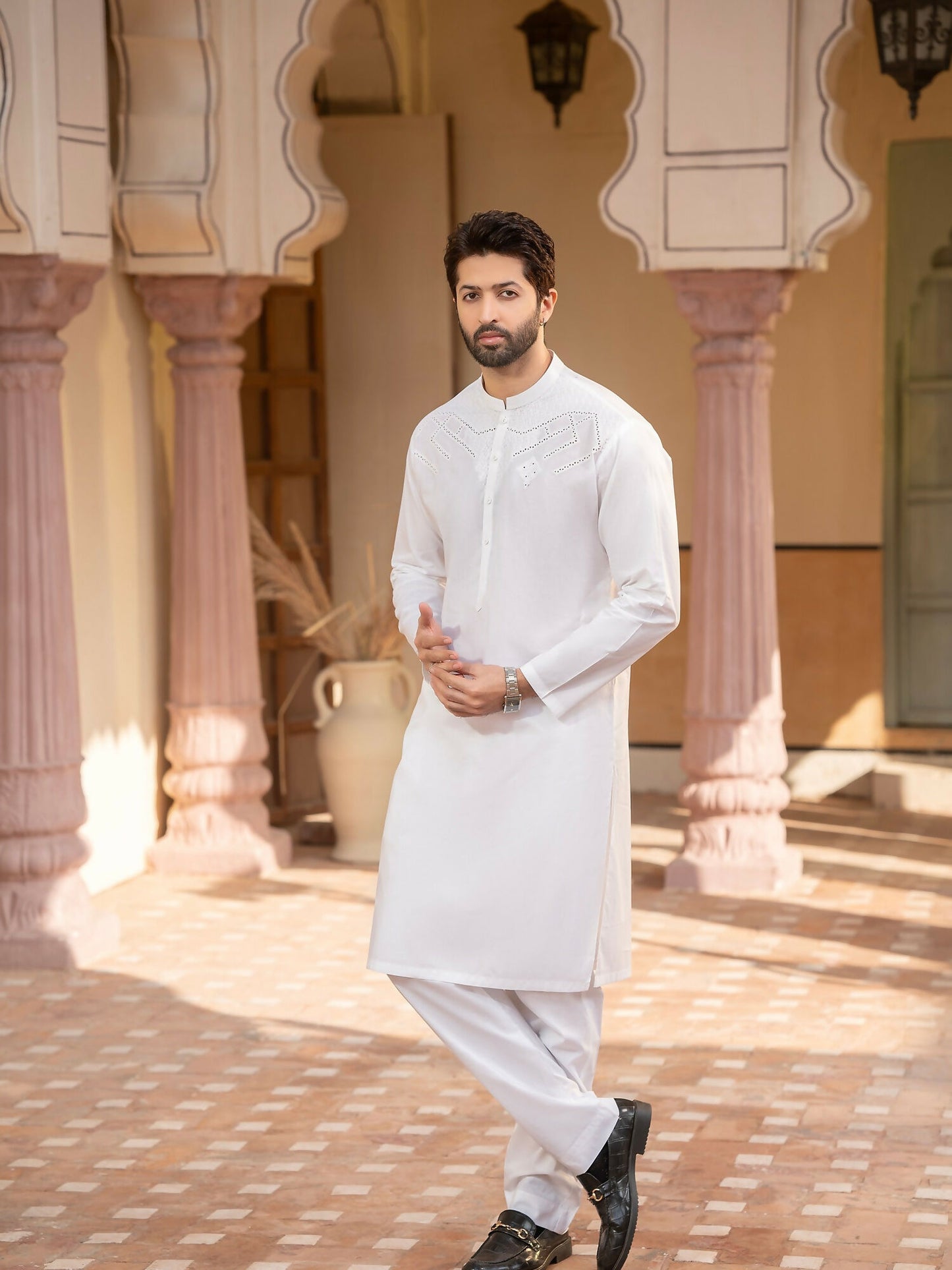 Off-white men’s unstitched kameez shalwar from Miraas by Fabrich, crafted in luxury soft fine 100% cotton, featuring intricate cotton-thread cutwork embroidery on the chest with a signature design pattern — accompanied by designer buttons, inlay card, and branded packaging.