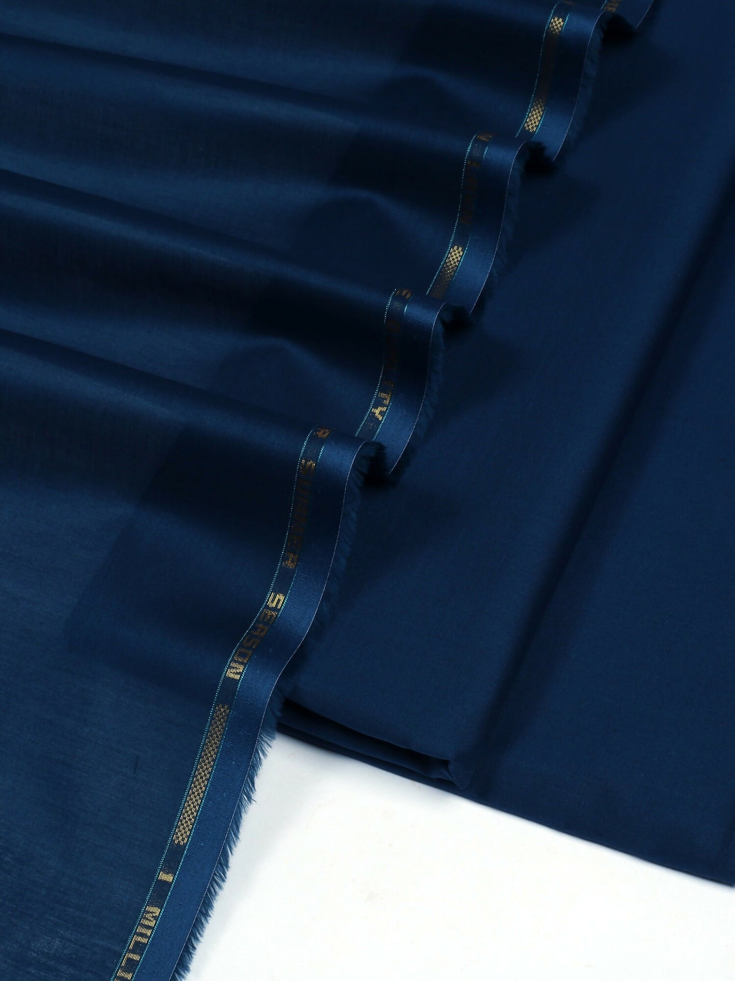 Prussian blue unstitched men’s kameez shalwar by Fabrich, made with 100% lawn for the kameez and premium Pima cotton for the shalwar, ideal for breathable summer wear.